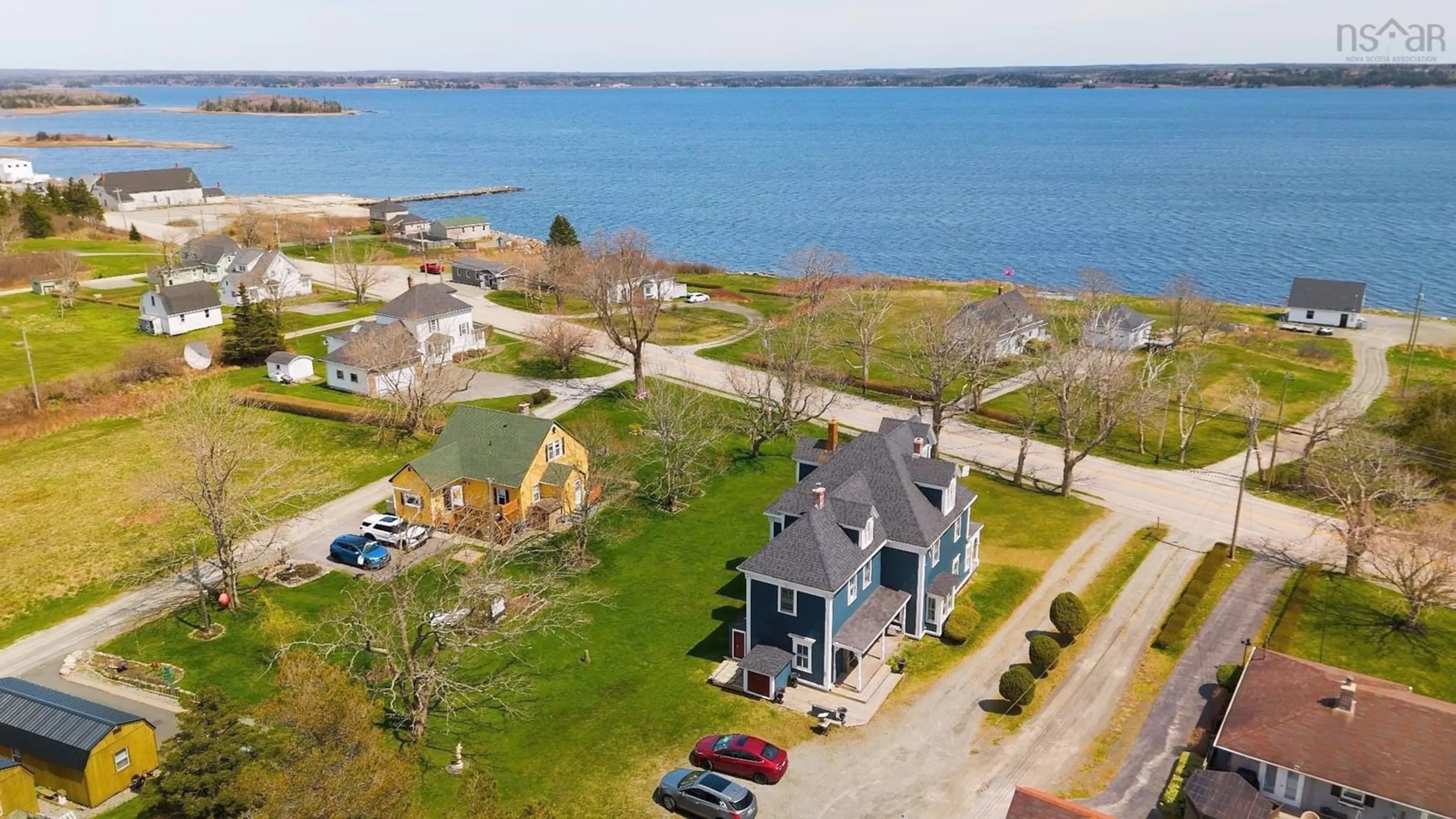 A pic from outside/outdoor area/front of a property/back of a property/a pic from drone, water/lake/river/ocean view for 1124 Highway 335, Middle West Pubnico Nova Scotia B0W 3S0