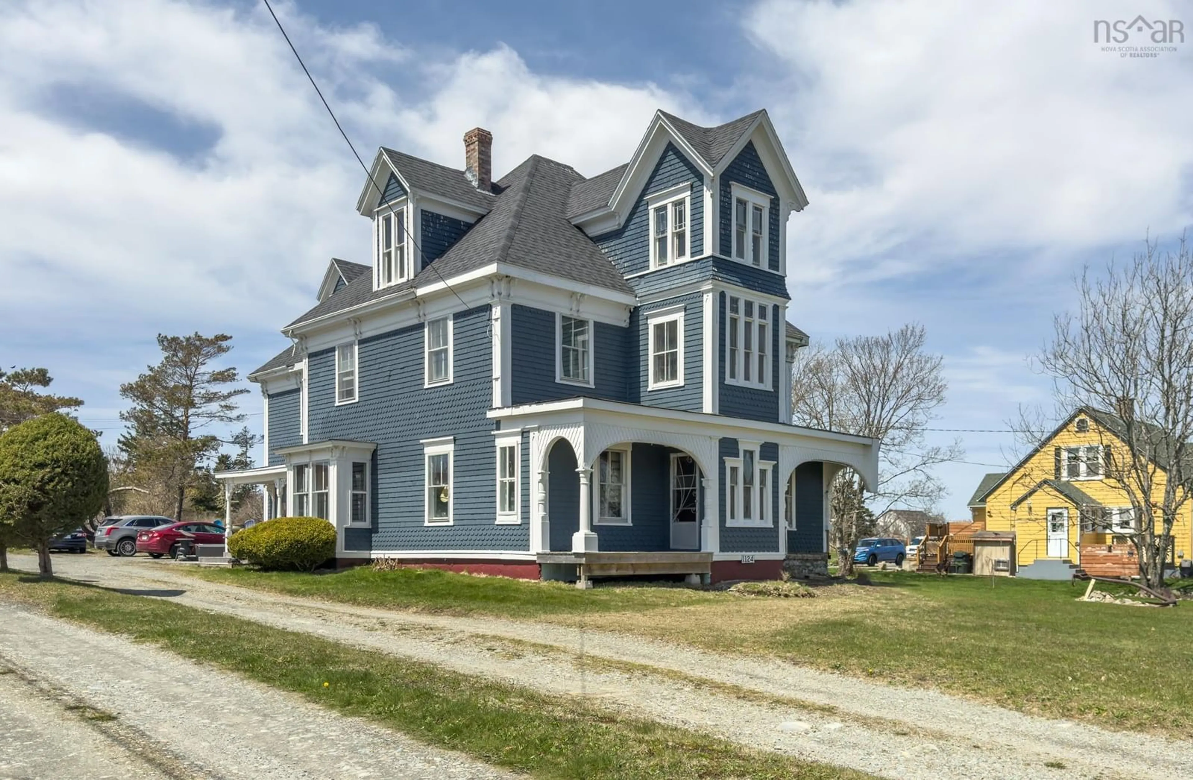 Home with vinyl exterior material, street for 1124 Highway 335, Middle West Pubnico Nova Scotia B0W 3S0