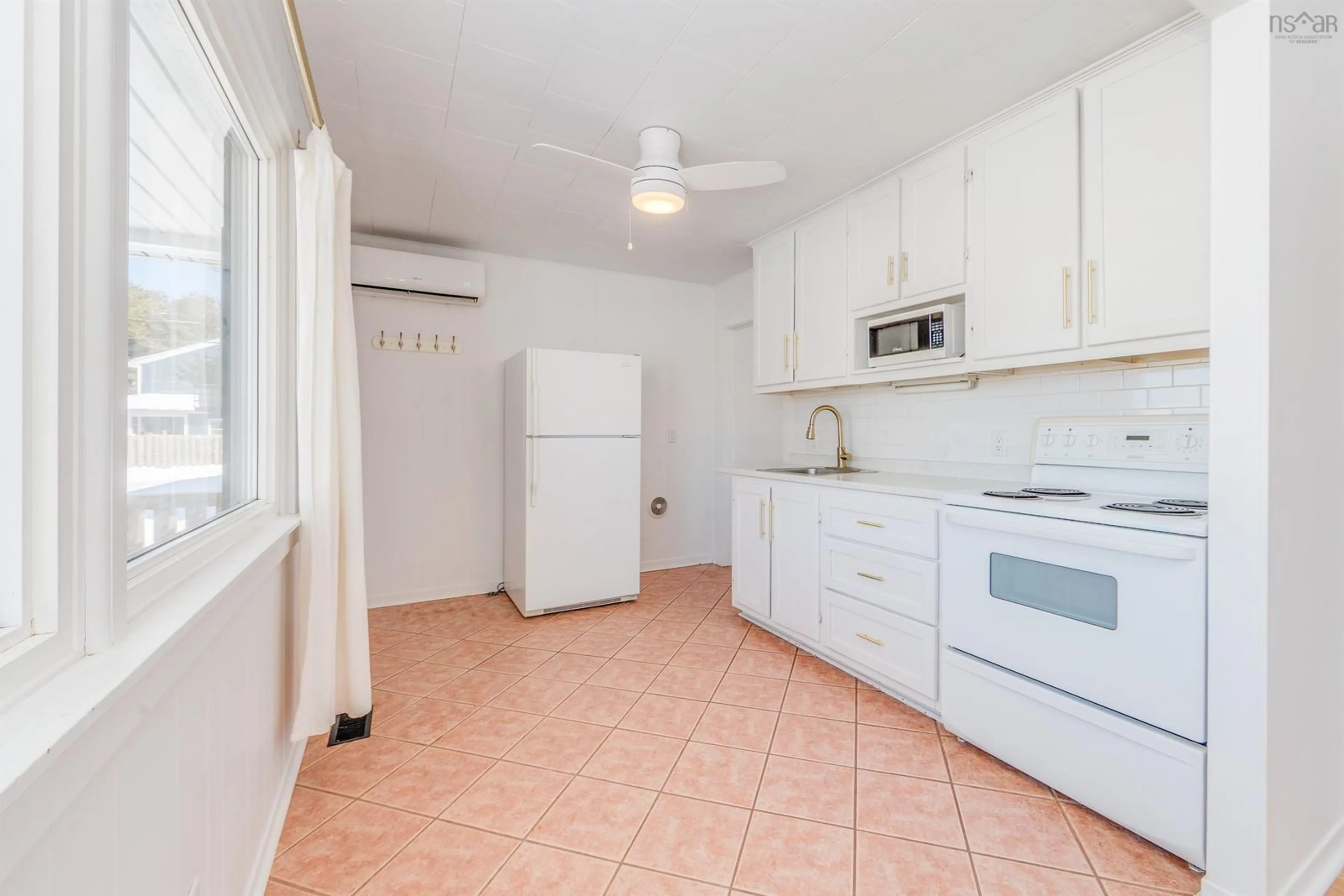 Standard kitchen, ceramic/tile floor for 737 Salmon River Rd, Murray Siding Nova Scotia B6L 4C1
