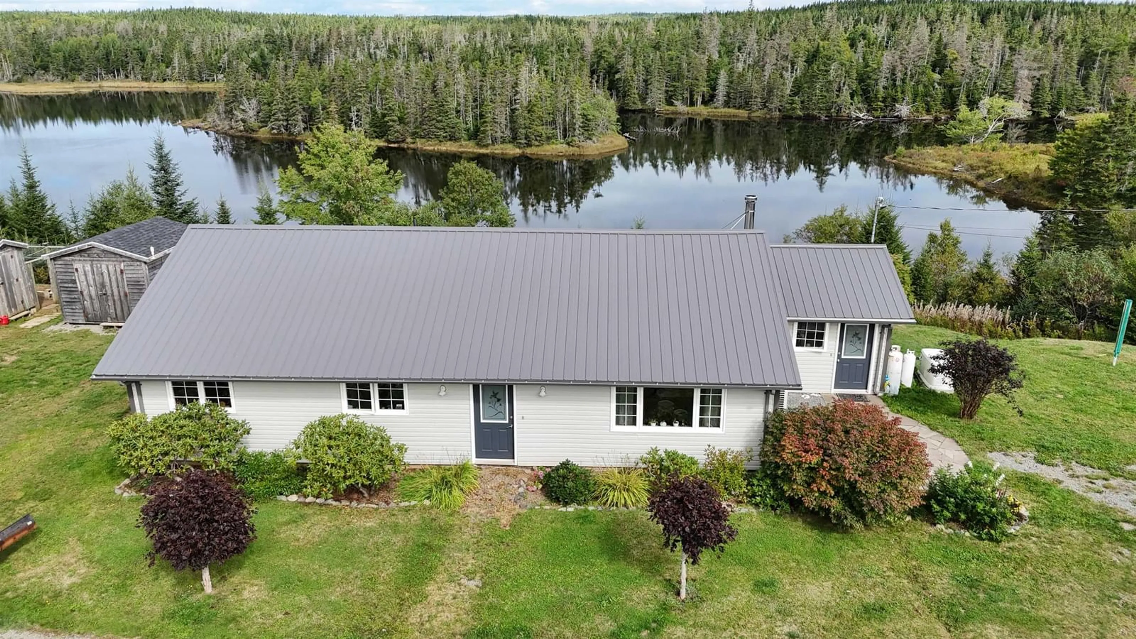A pic from outside/outdoor area/front of a property/back of a property/a pic from drone, water/lake/river/ocean view for 1757 St Peters Fourchu Rd, Grand River Nova Scotia B0E 1M0
