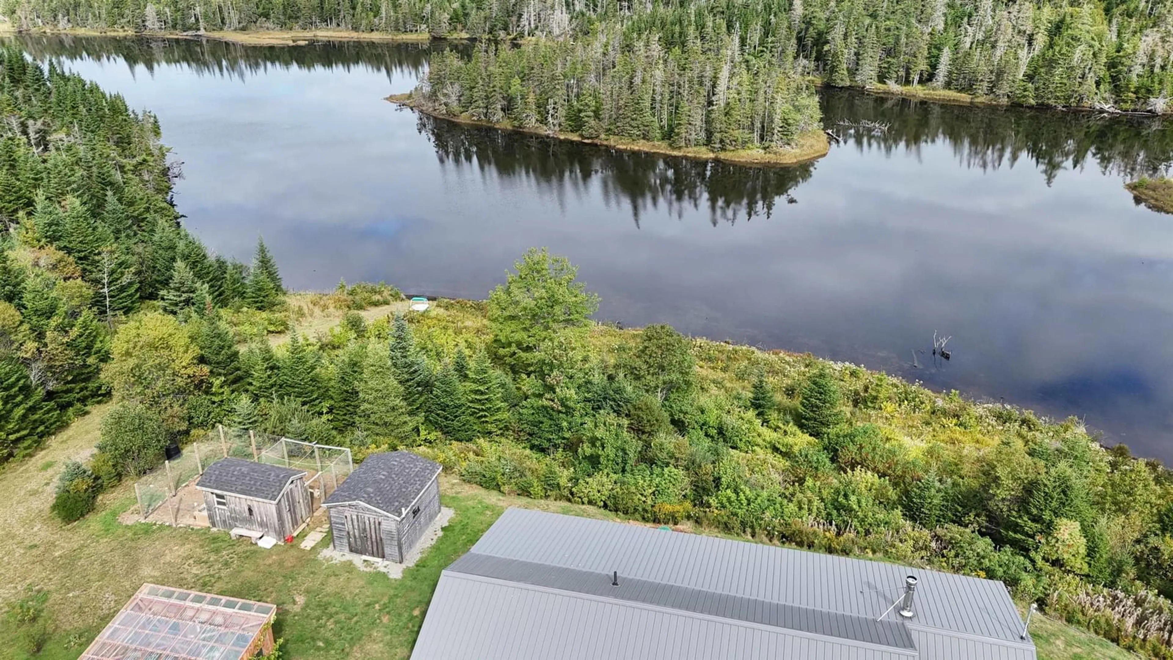 A pic from outside/outdoor area/front of a property/back of a property/a pic from drone, water/lake/river/ocean view for 1757 St Peters Fourchu Rd, Grand River Nova Scotia B0E 1M0