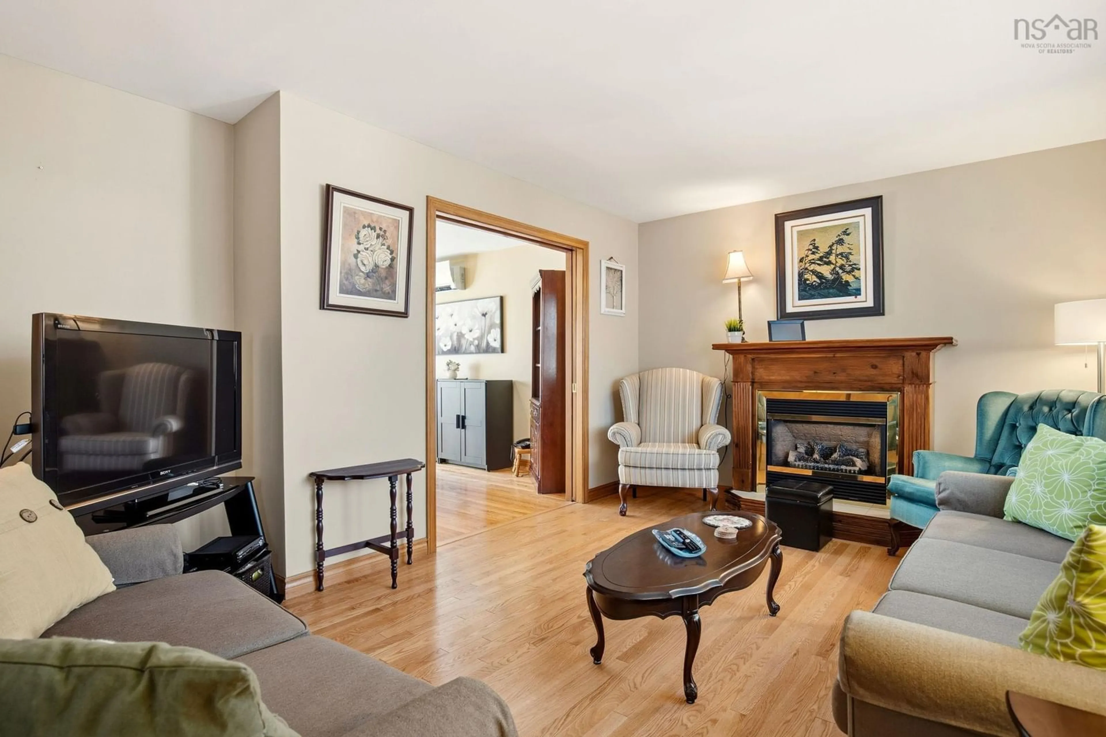 Living room with furniture, wood/laminate floor for 234 Chandler Dr, Lower Sackville Nova Scotia B4C 1Y2
