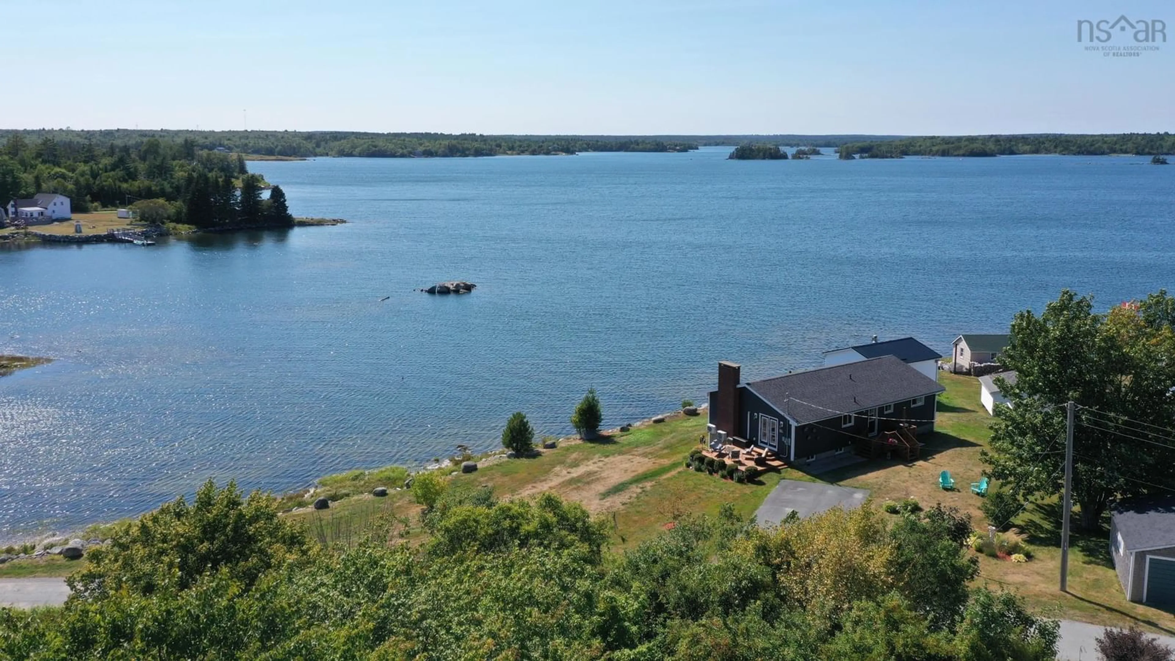 A pic from outside/outdoor area/front of a property/back of a property/a pic from drone, water/lake/river/ocean view for 31 Medway St, Port Medway Nova Scotia B0J 2T0
