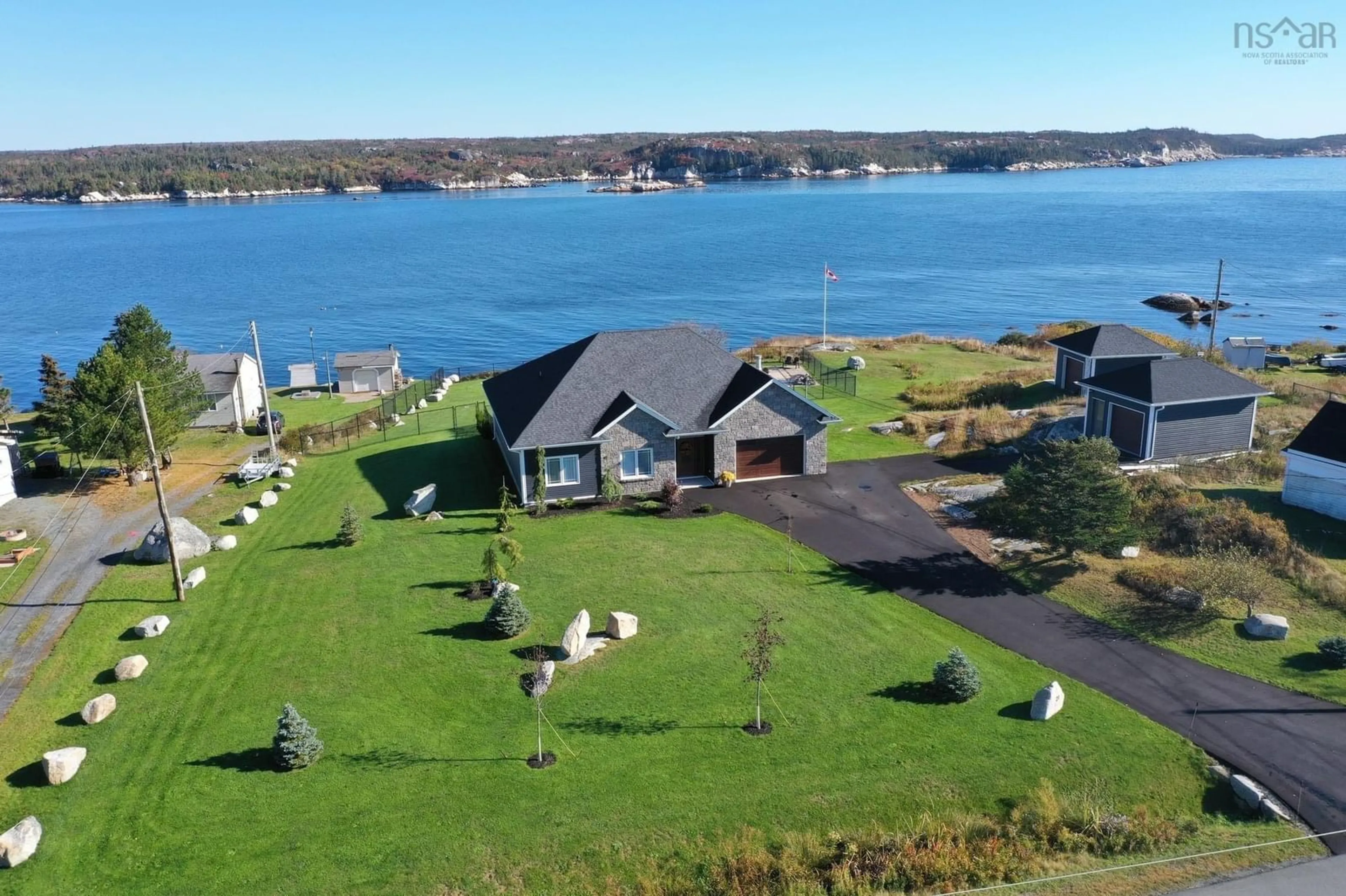 A pic from outside/outdoor area/front of a property/back of a property/a pic from drone, water/lake/river/ocean view for 21 Back Lane, Terence Bay Nova Scotia B3T 1Y3