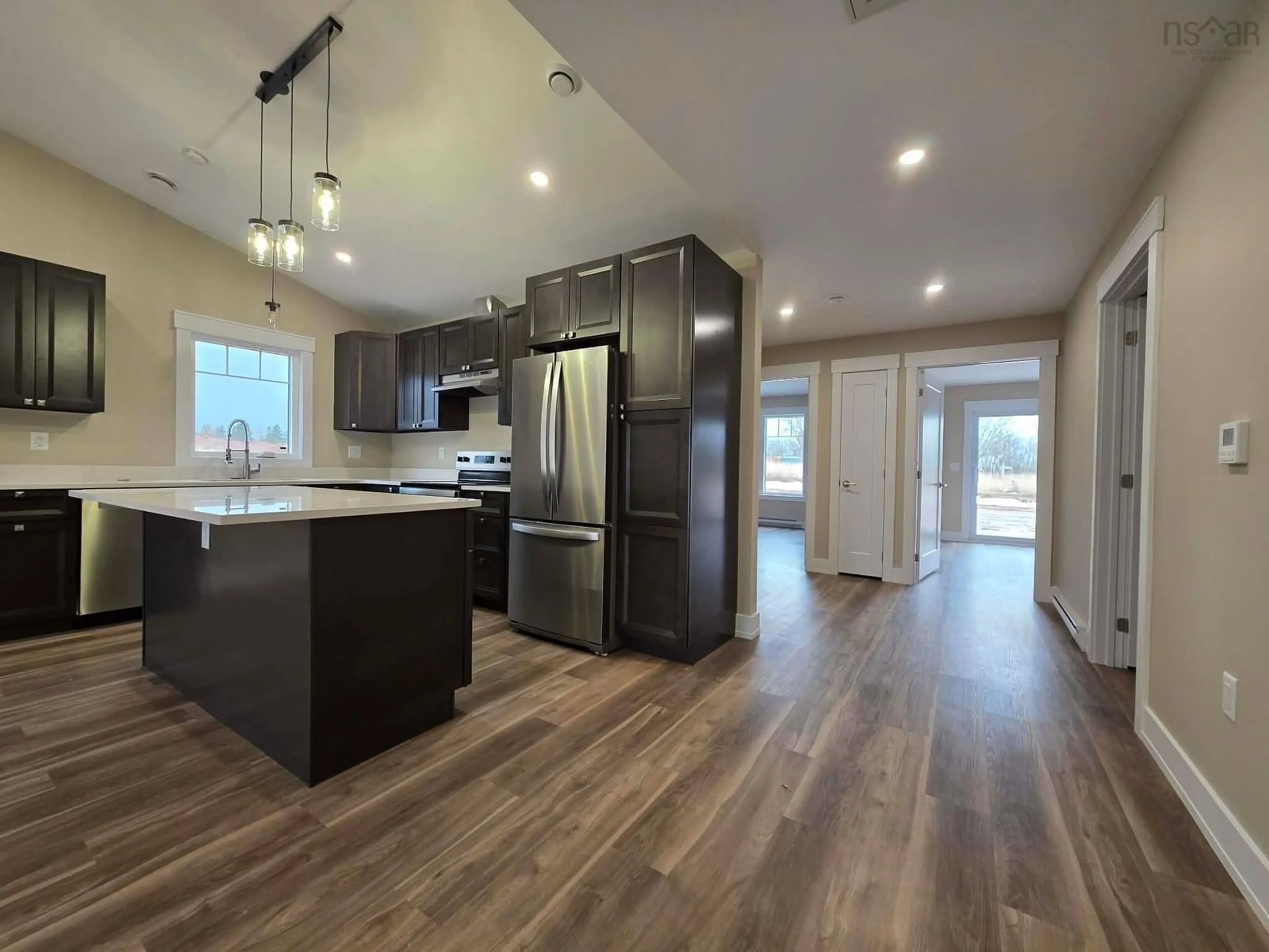 Open concept kitchen, wood/laminate floor for 56A Summer Hill Pl, Upper Onslow Nova Scotia B6L 0G9