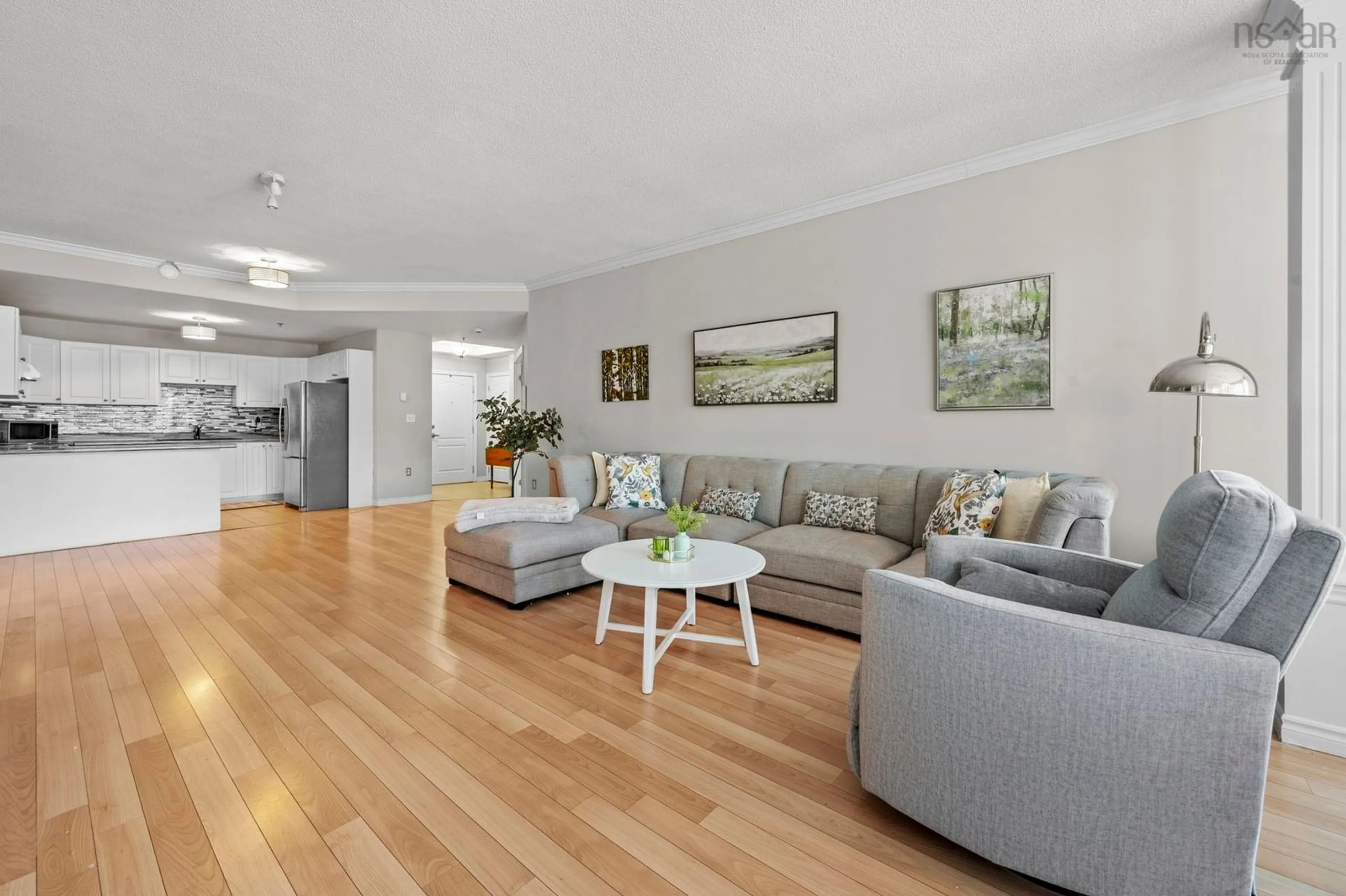 Living room with furniture, wood/laminate floor for 78 Regency Park Dr #106, Clayton Park Nova Scotia B3S 1T2