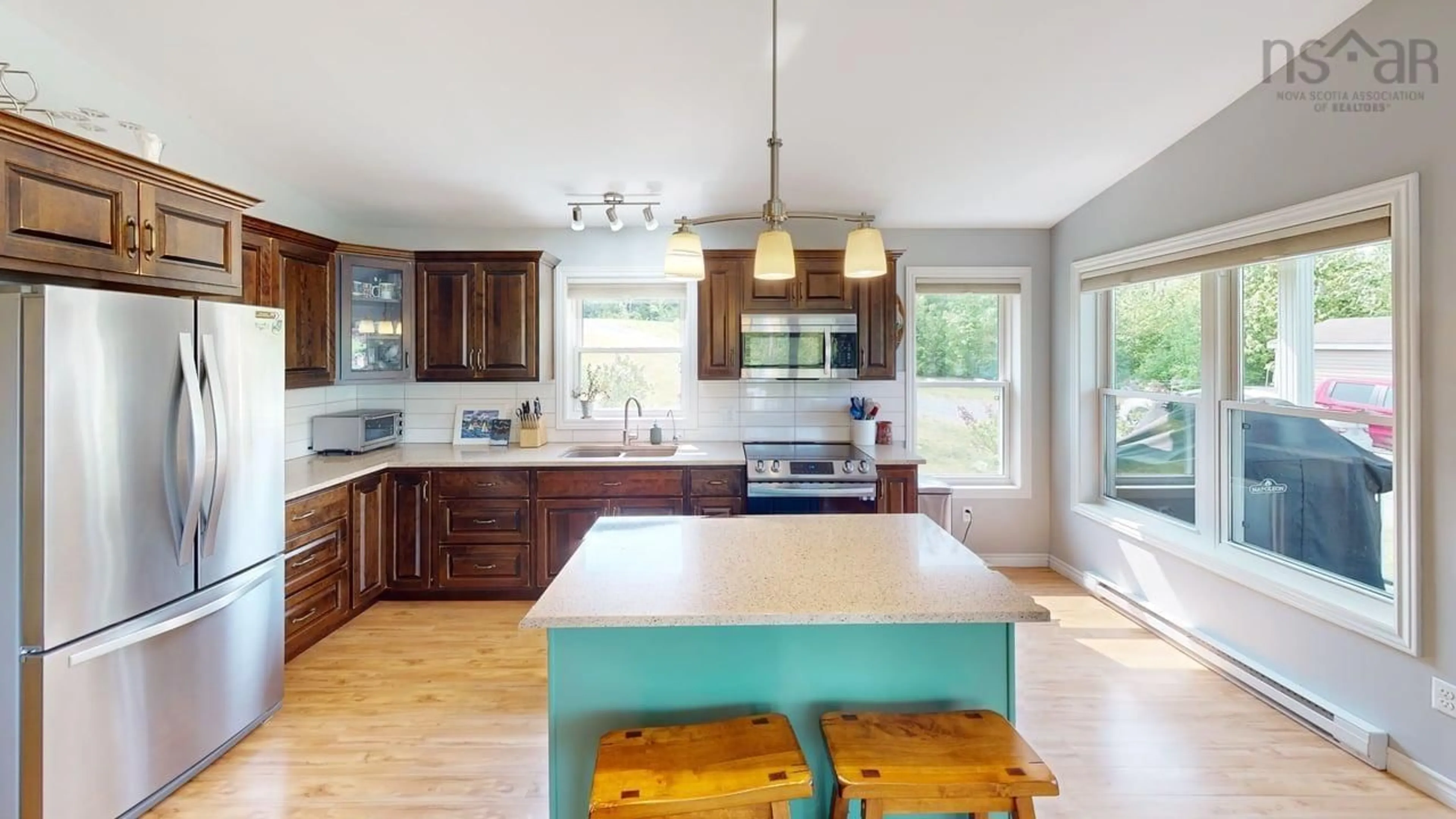 Open concept kitchen, wood/laminate floor for 13791 Nova Scotia Trunk 7, Lochiel Lake Nova Scotia B2G 2L3