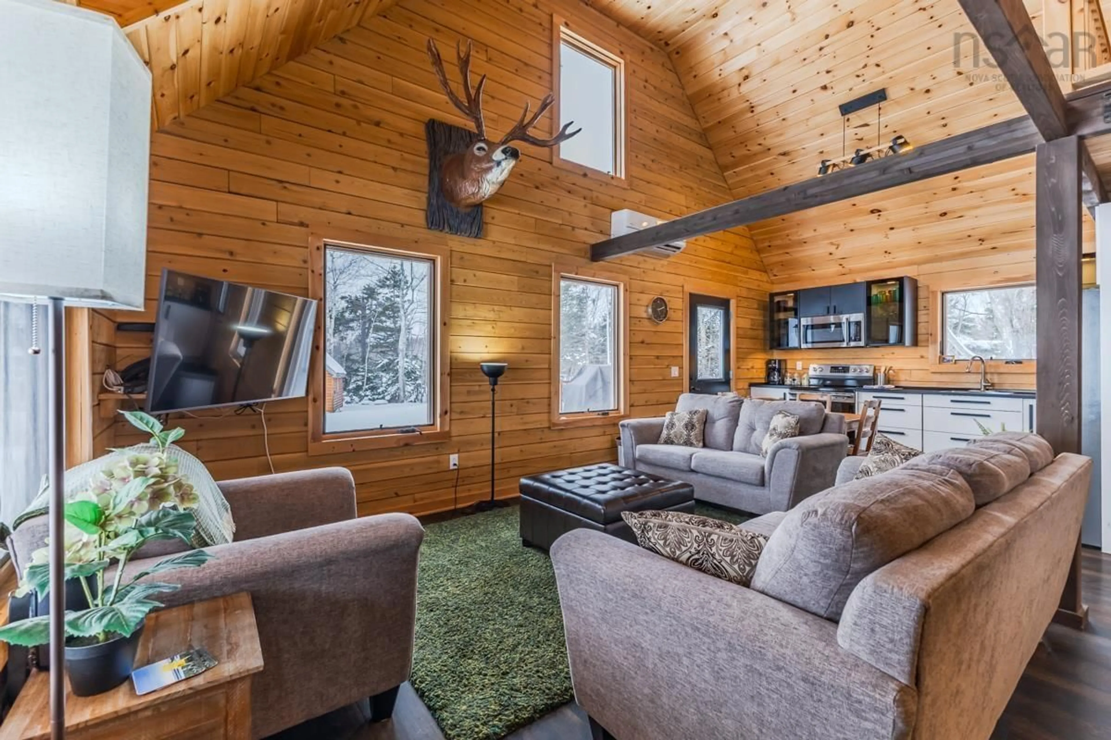 Living room with furniture, wood/laminate floor for 1124 Sandpoint Rd, Sand Point Nova Scotia B0K 1V0