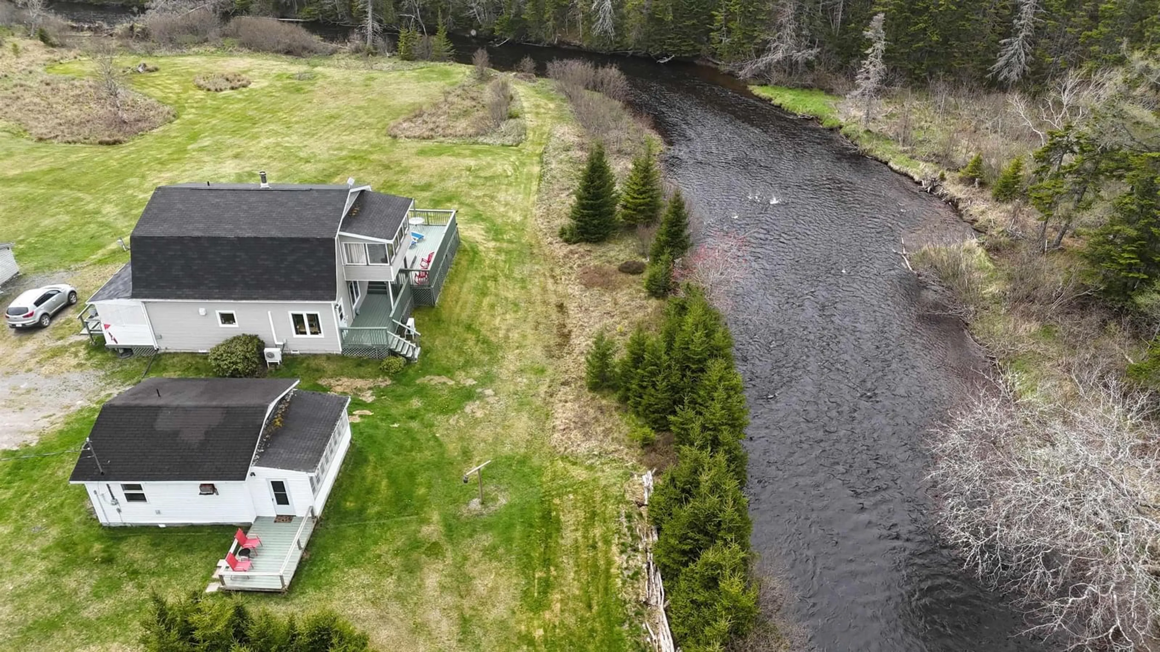 A pic from outside/outdoor area/front of a property/back of a property/a pic from drone, water/lake/river/ocean view for 1235 Loch Lomond Rd, Grand River Falls Nova Scotia B0E 1M0