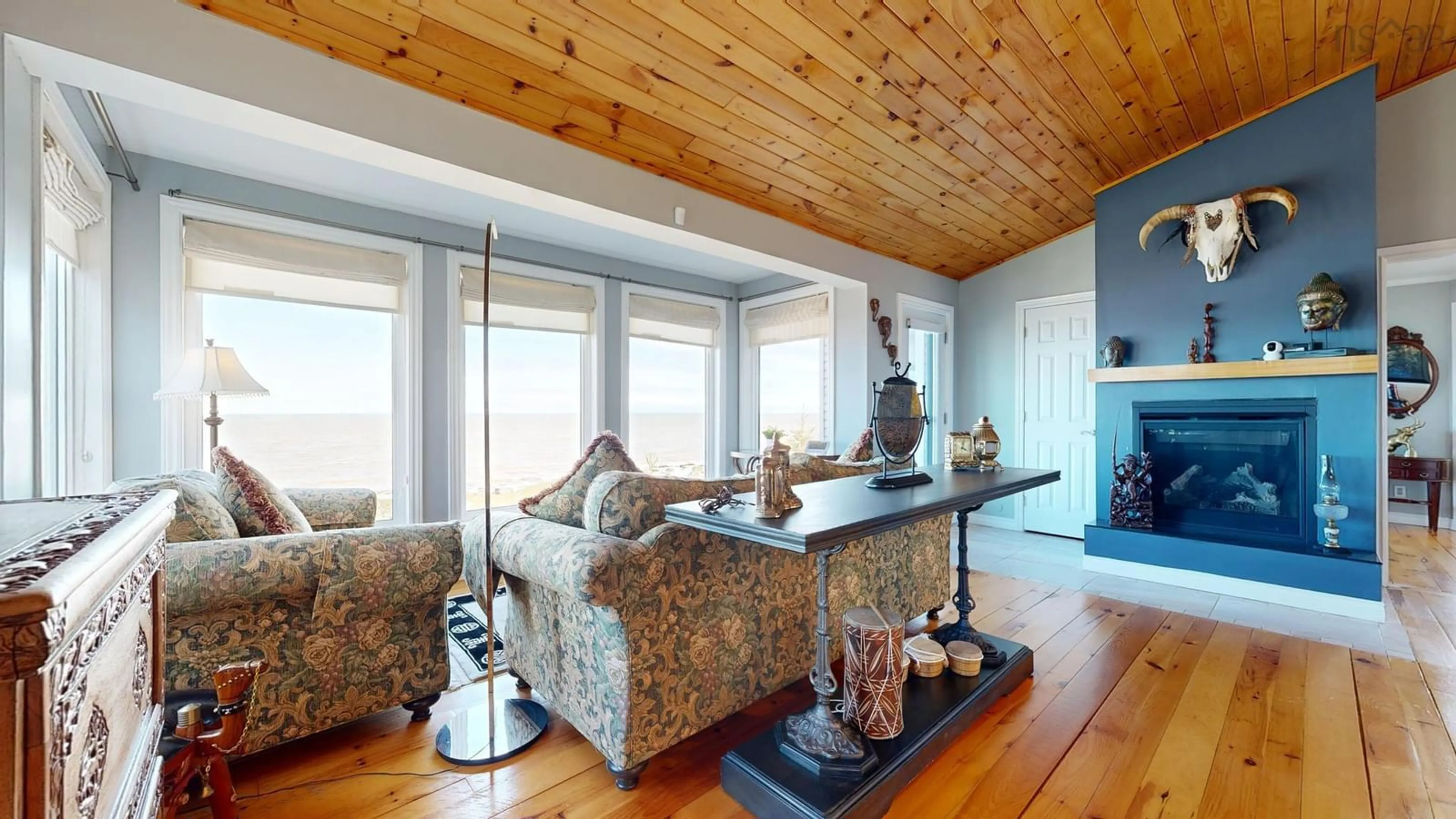 Living room with furniture, wood/laminate floor for 59 Sunset Avenue, Phinneys Cove Nova Scotia B0S 1L0