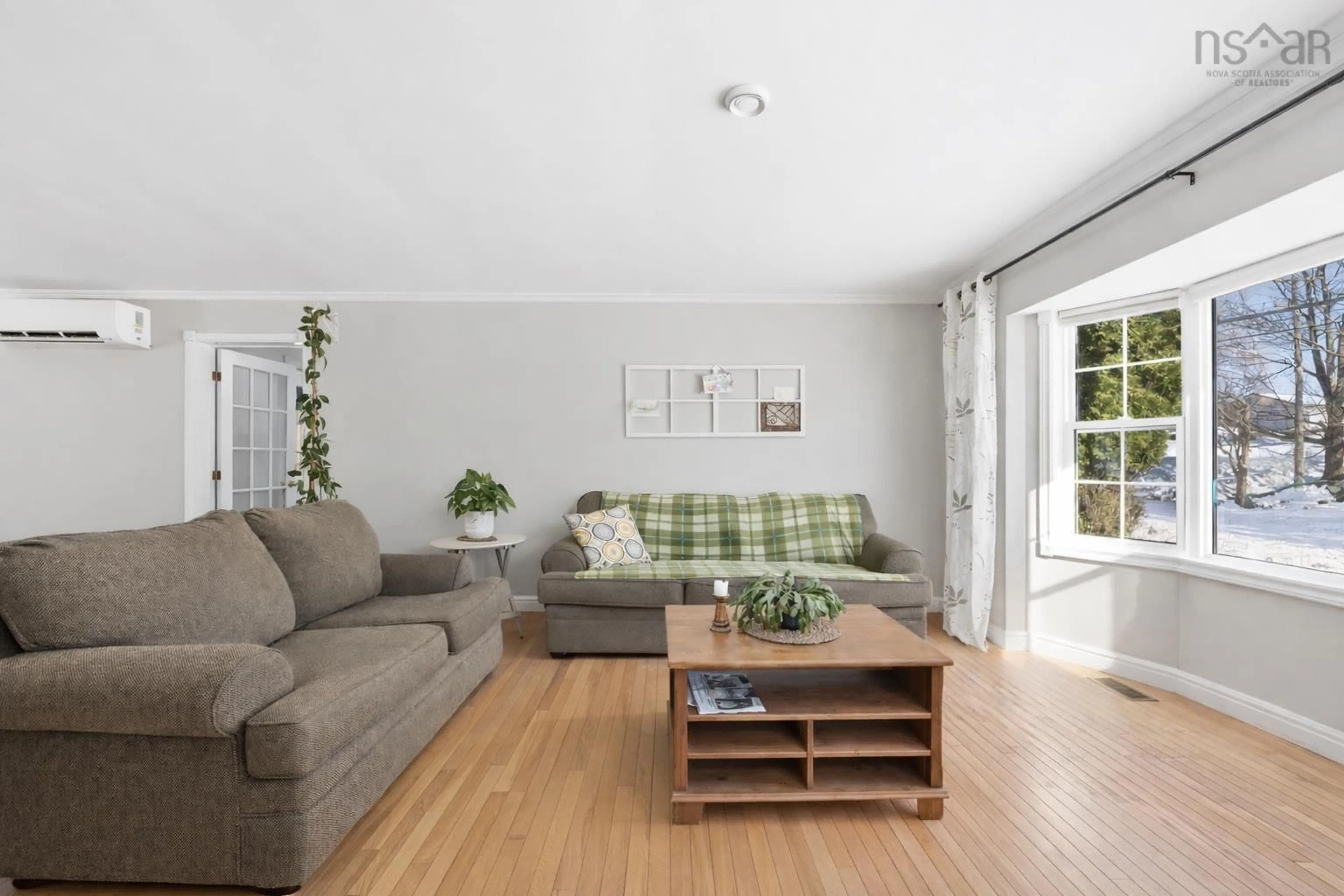 Living room with furniture, wood/laminate floor for 24 Rand St, Hantsport Nova Scotia B0P 1P0