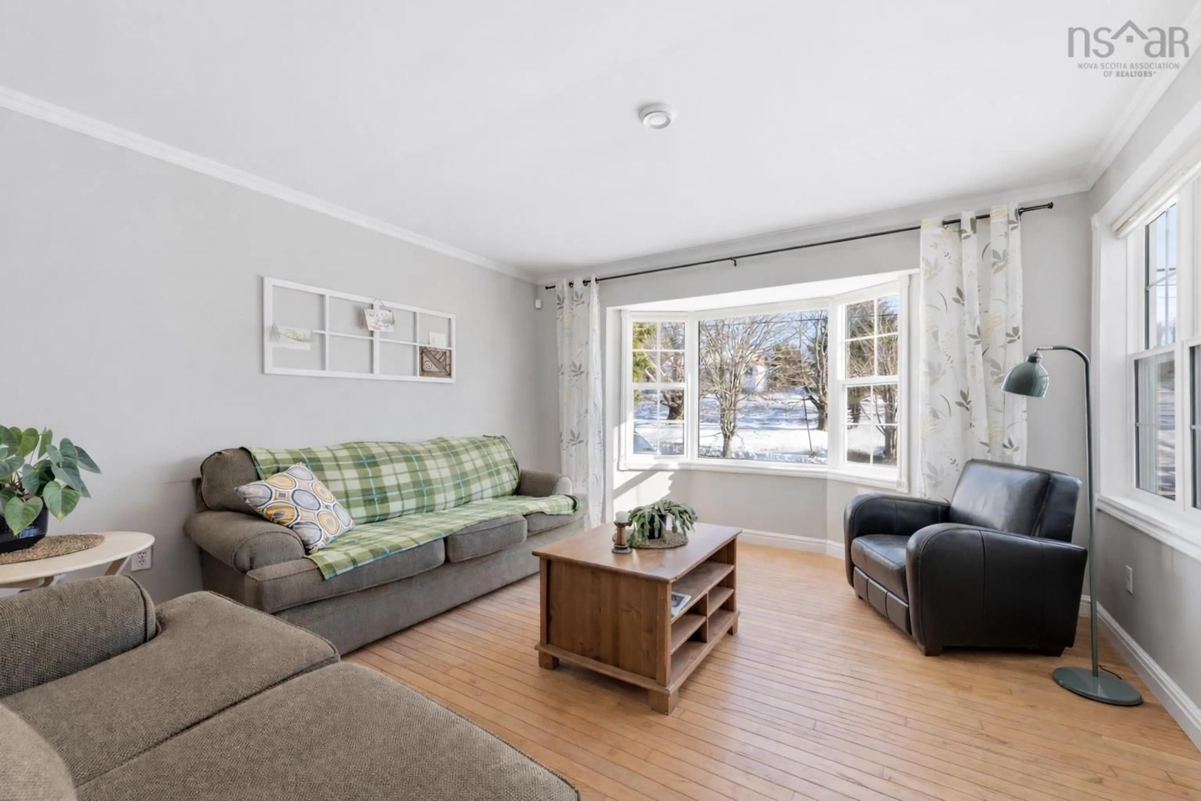 Living room with furniture, wood/laminate floor for 24 Rand St, Hantsport Nova Scotia B0P 1P0