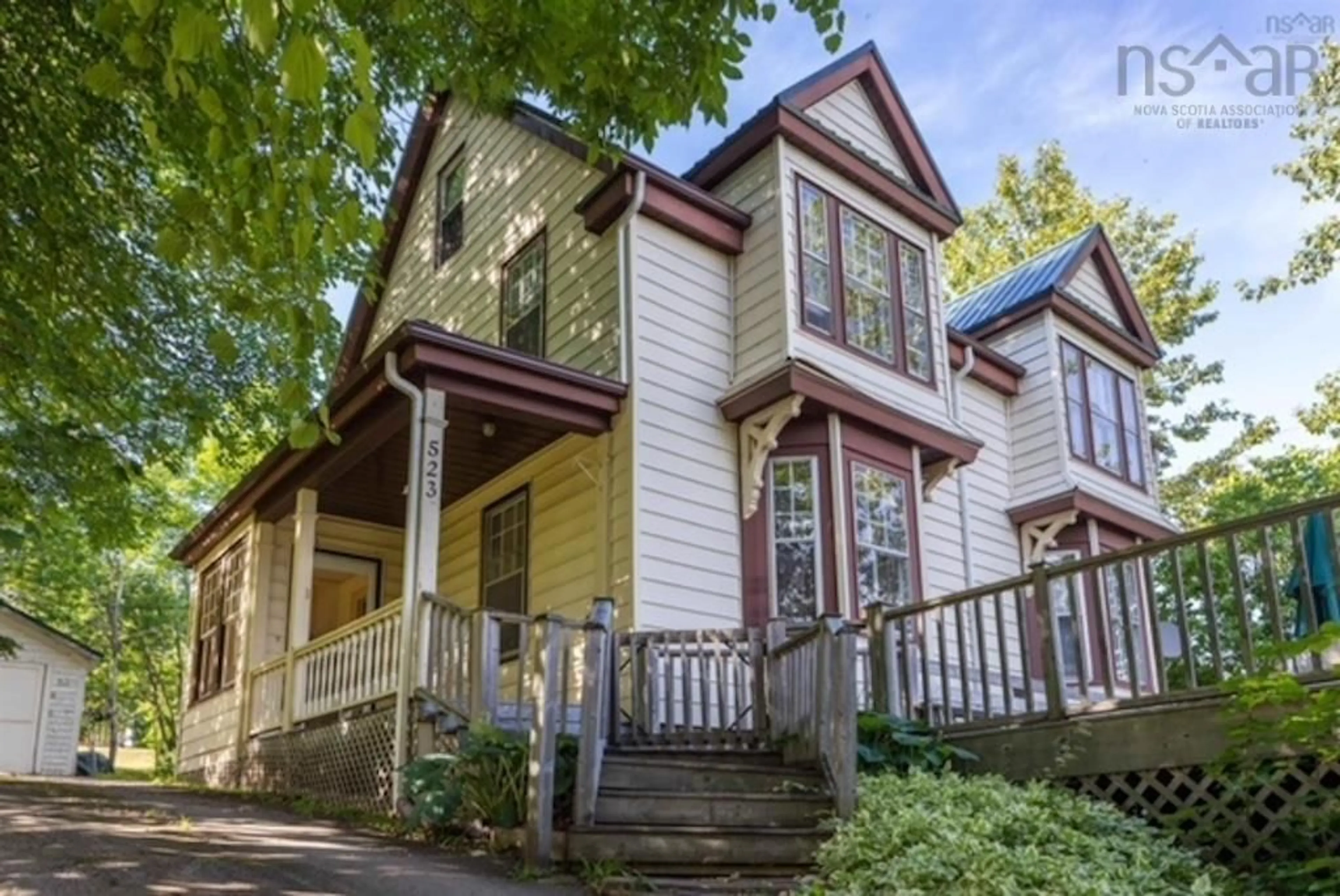 Home with vinyl exterior material, street for 523 Chebucto St, Baddeck Nova Scotia B0E 1B0