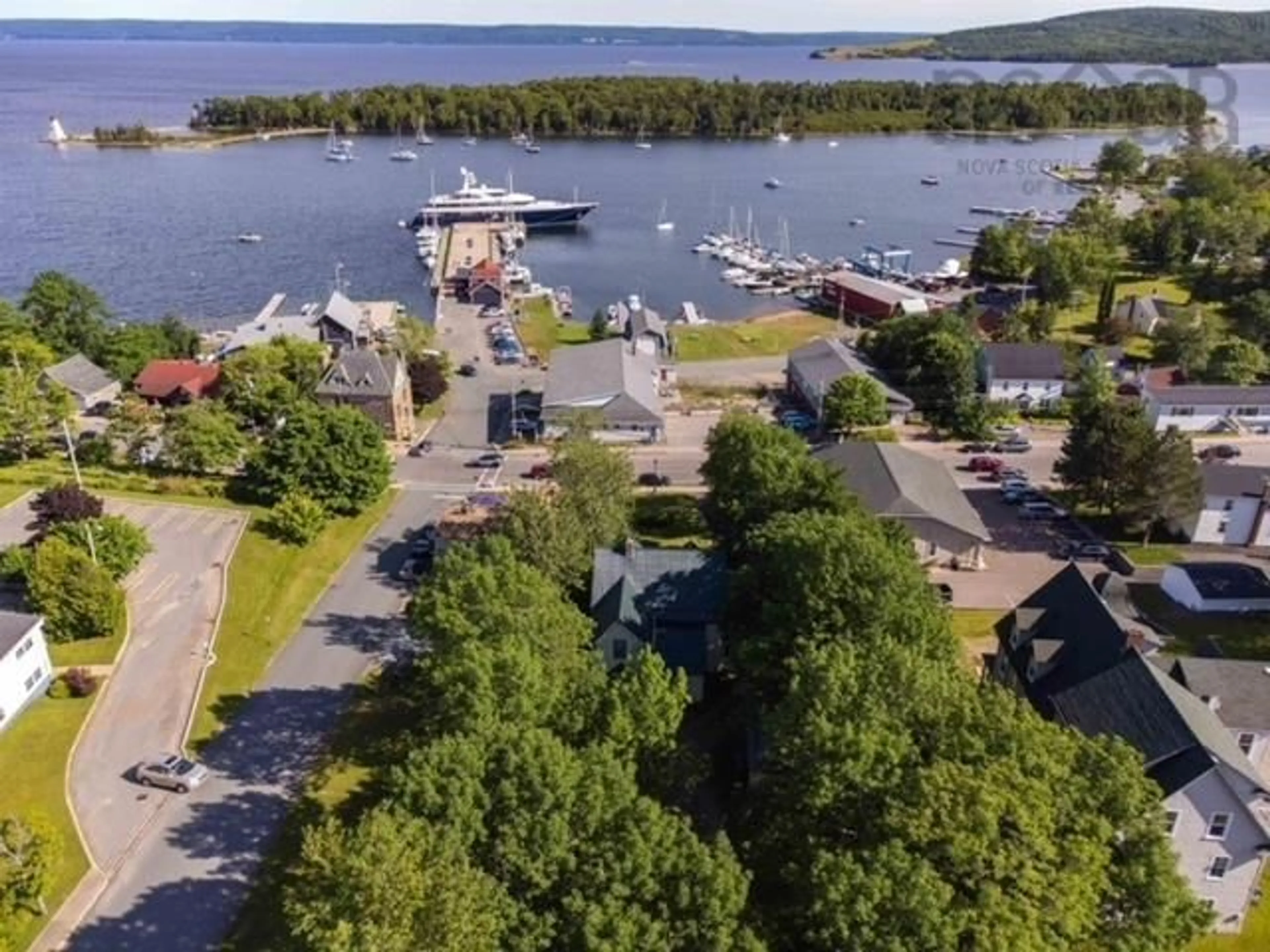 A pic from outside/outdoor area/front of a property/back of a property/a pic from drone, water/lake/river/ocean view for 523 Chebucto St, Baddeck Nova Scotia B0E 1B0