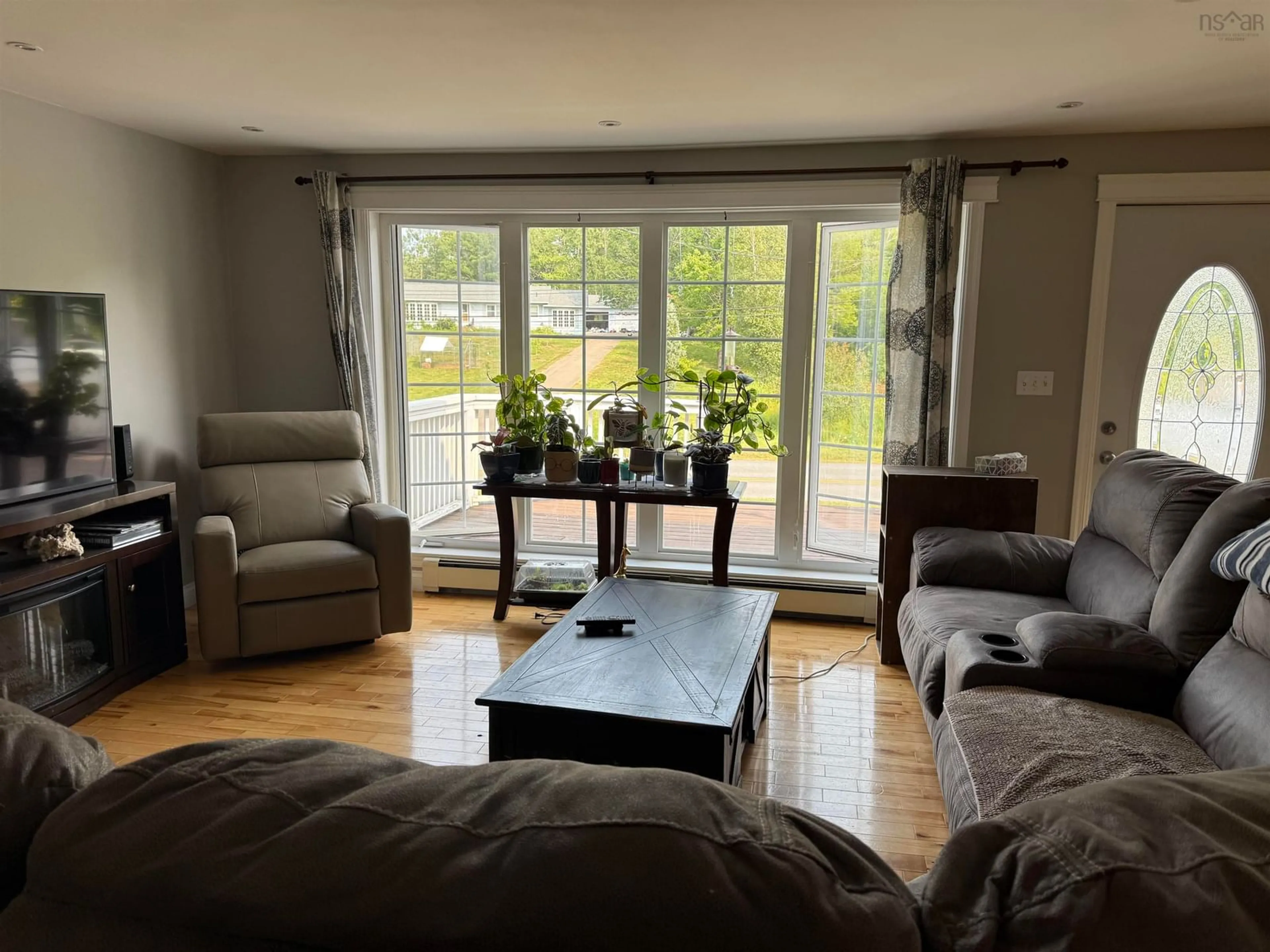 Living room with furniture, wood/laminate floor for 123 Chance Harbour Rd, Hillside Nova Scotia B0K 1X0