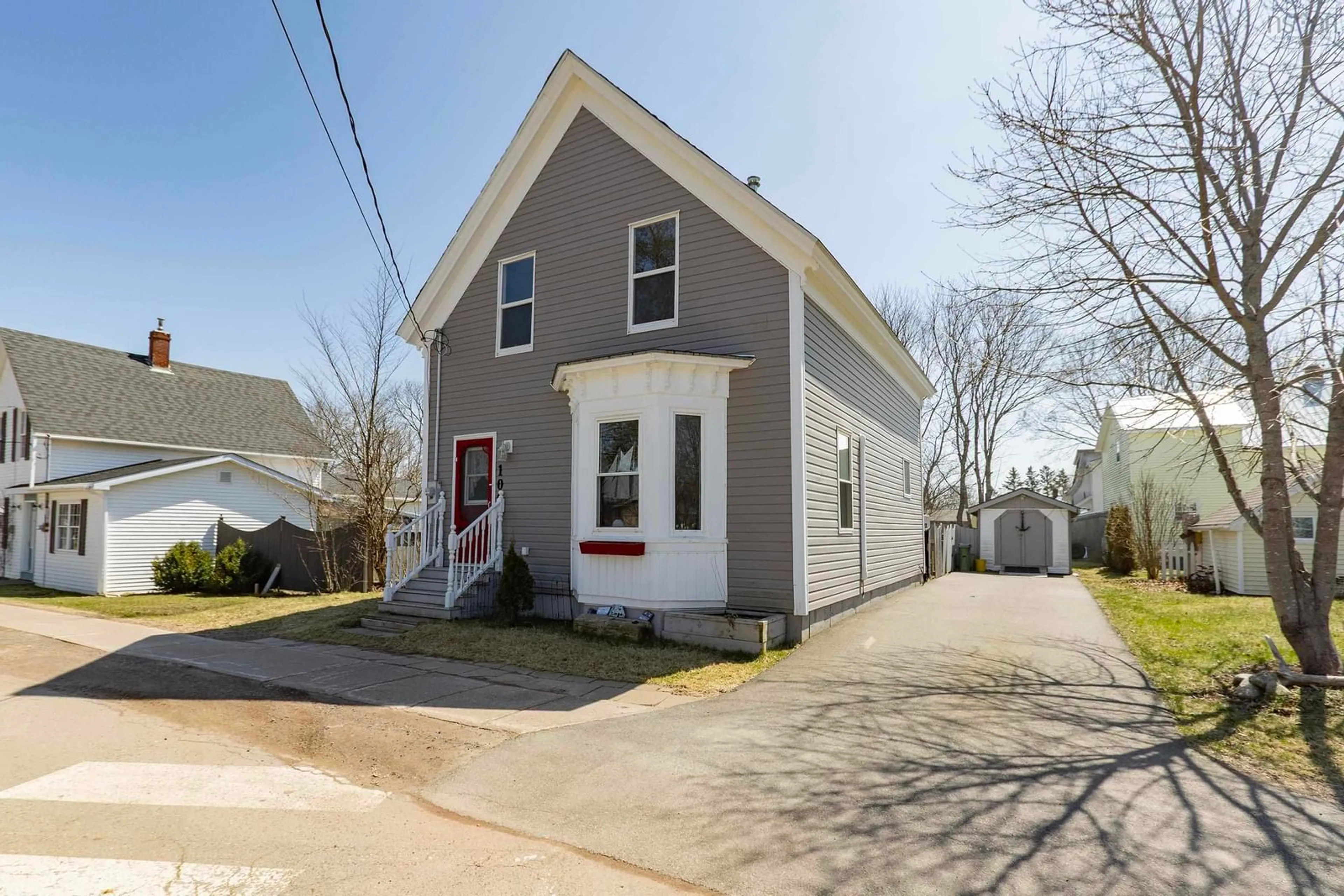 Home with vinyl exterior material, street for 100 Queen St, Parrsboro Nova Scotia B0M 1S0