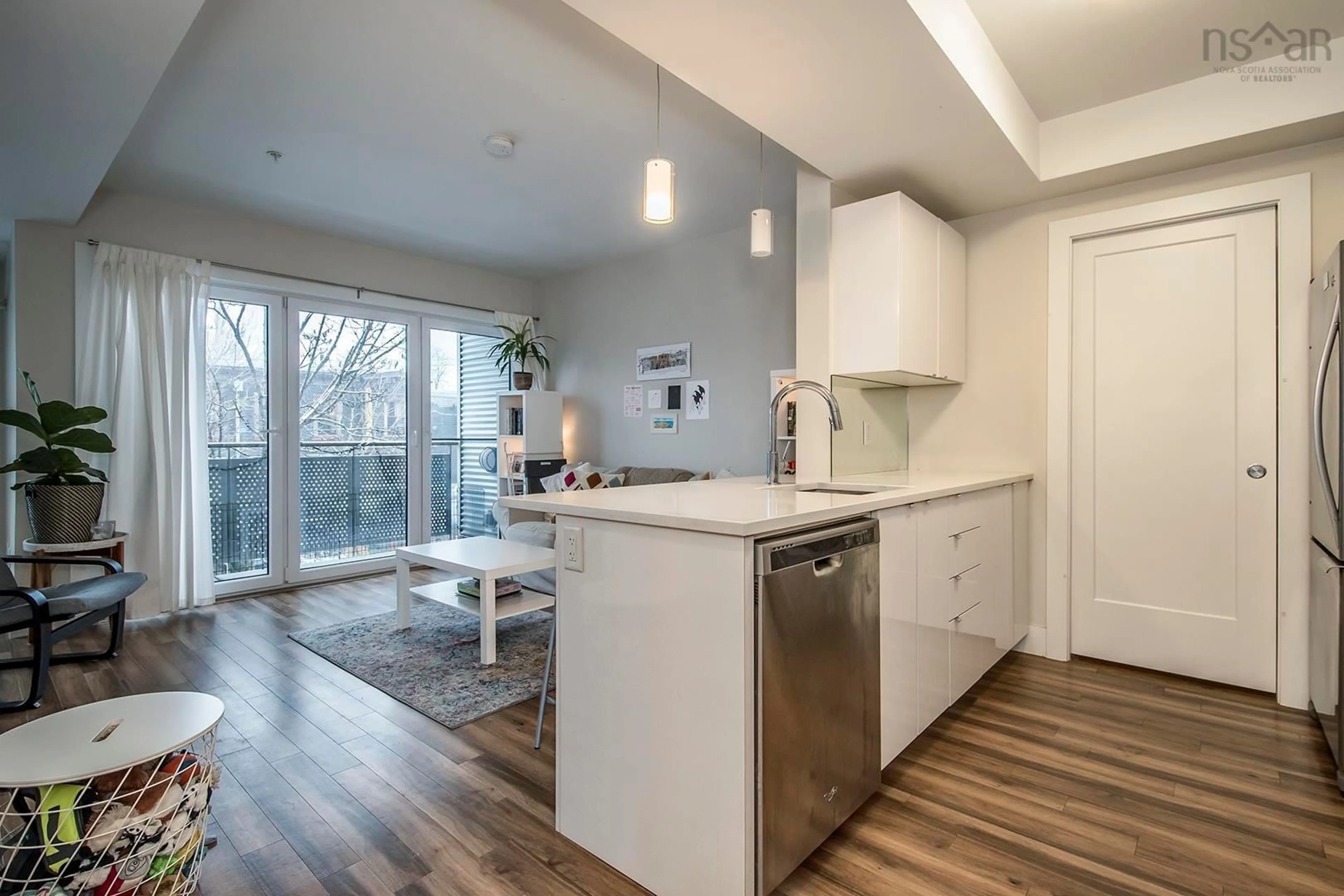 Open concept kitchen, wood/laminate floor for 5677 Harris St #213, Halifax Nova Scotia B3K 0G4