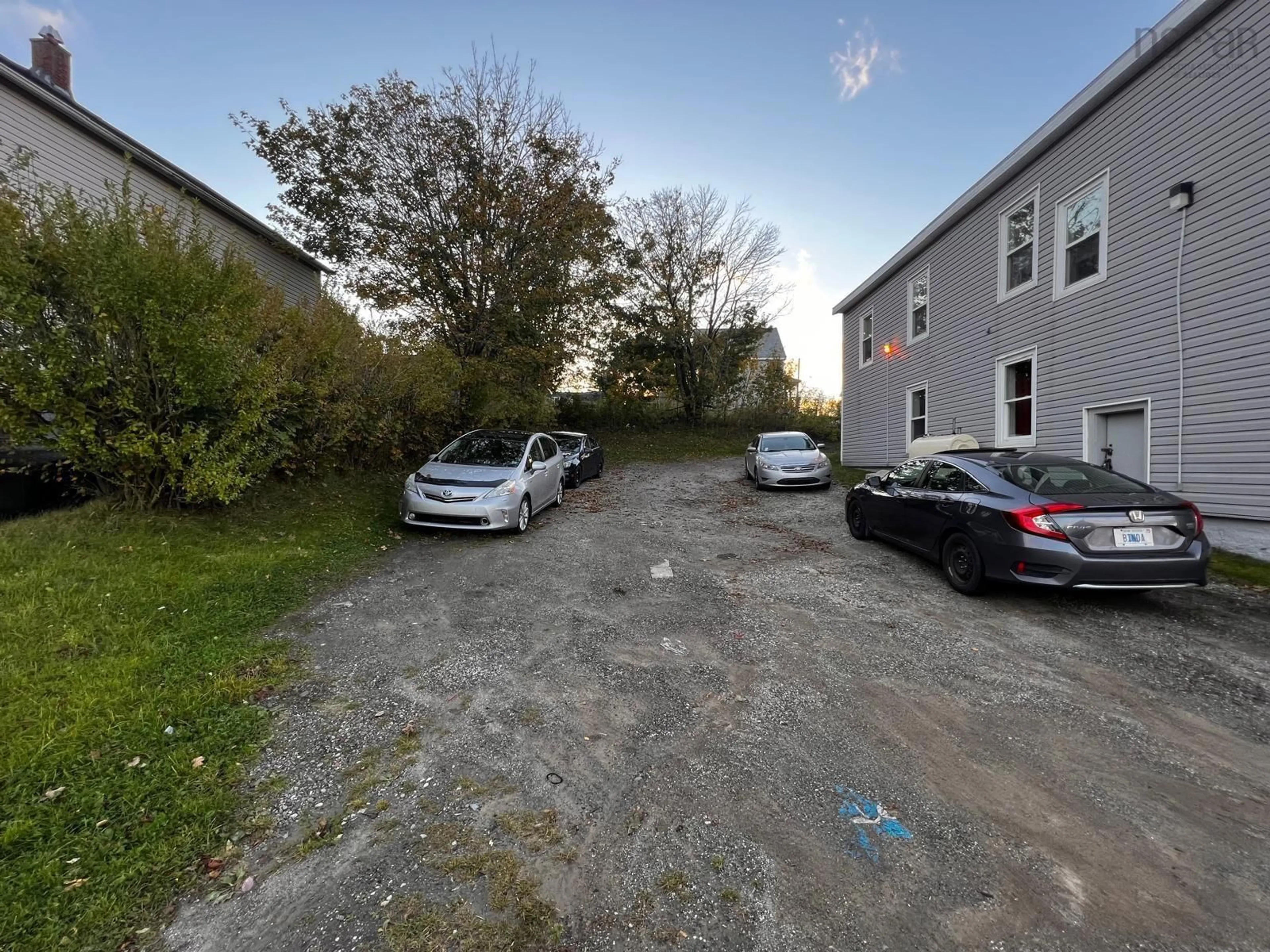 A pic from outside/outdoor area/front of a property/back of a property/a pic from drone, street for 971 Victoria Rd, Sydney Nova Scotia B1N 1K6