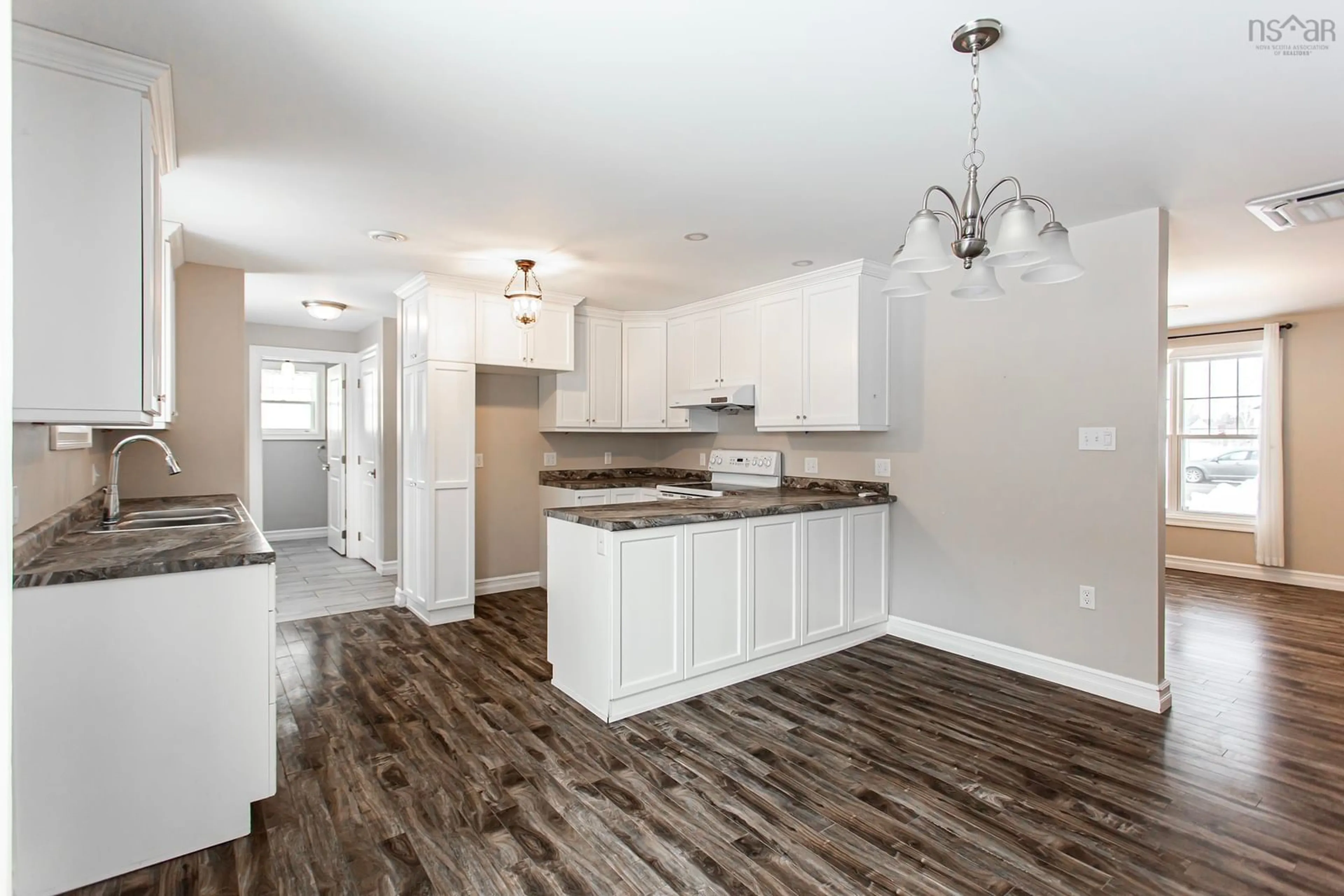 Open concept kitchen, wood/laminate floor for 25 Gates Ave, Middleton Nova Scotia B0S 1P0