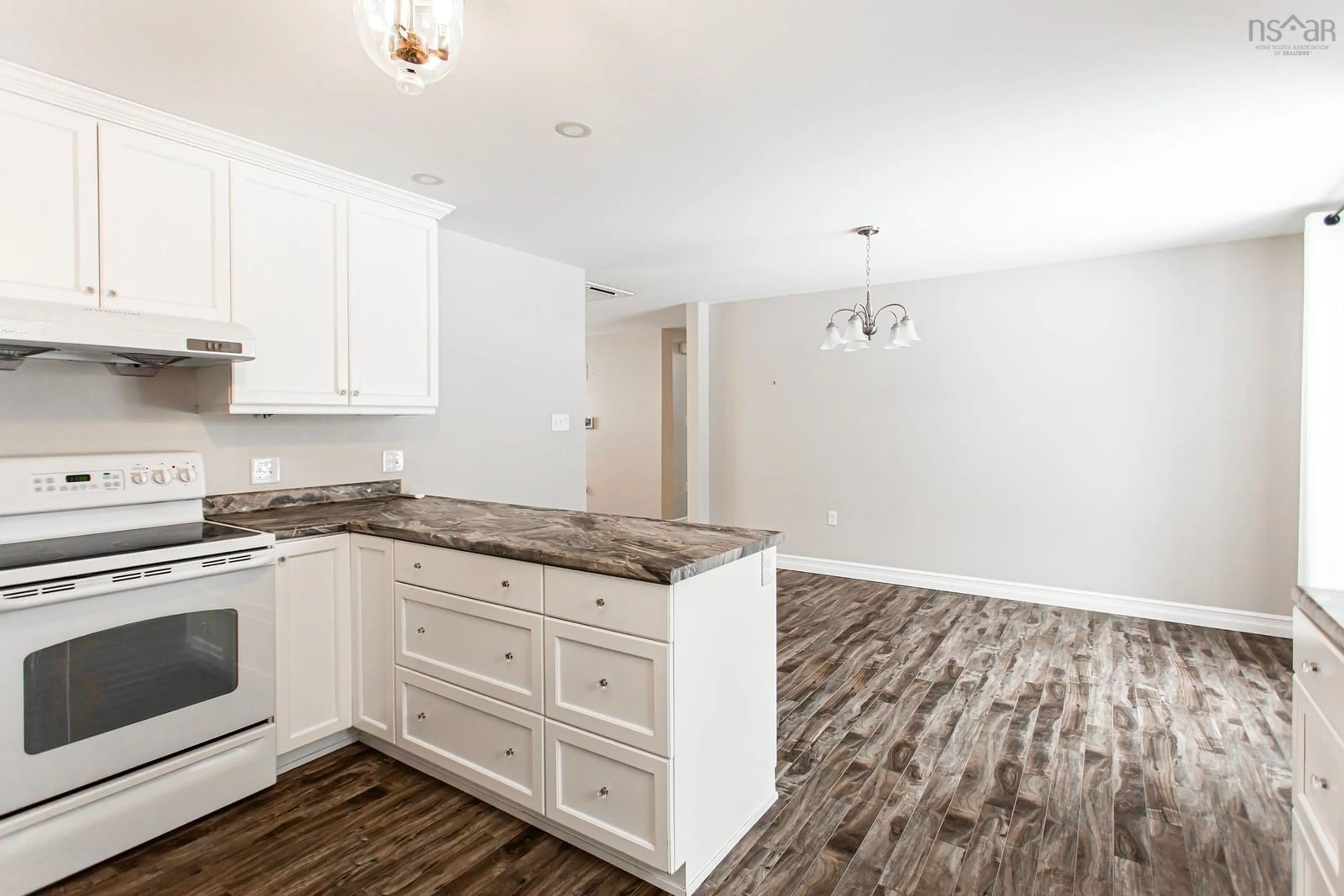 Open concept kitchen, wood/laminate floor for 25 Gates Ave, Middleton Nova Scotia B0S 1P0