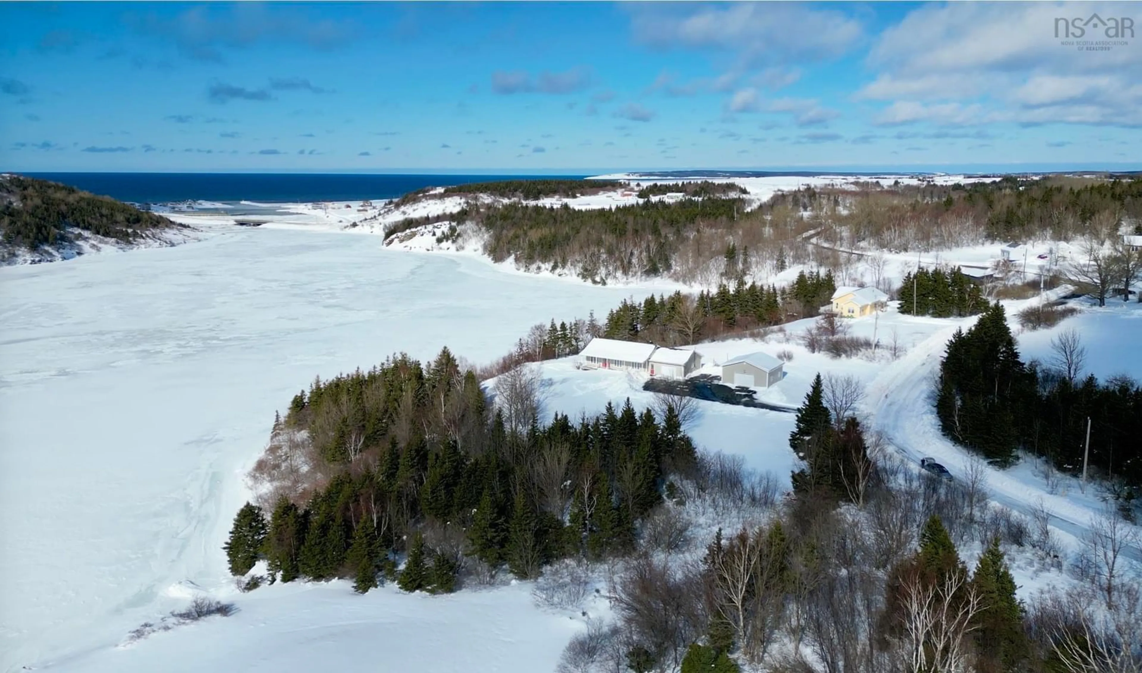 A pic from outside/outdoor area/front of a property/back of a property/a pic from drone, water/lake/river/ocean view for 1279 Macgarry Road, Grand Étang Nova Scotia B0E 1L0