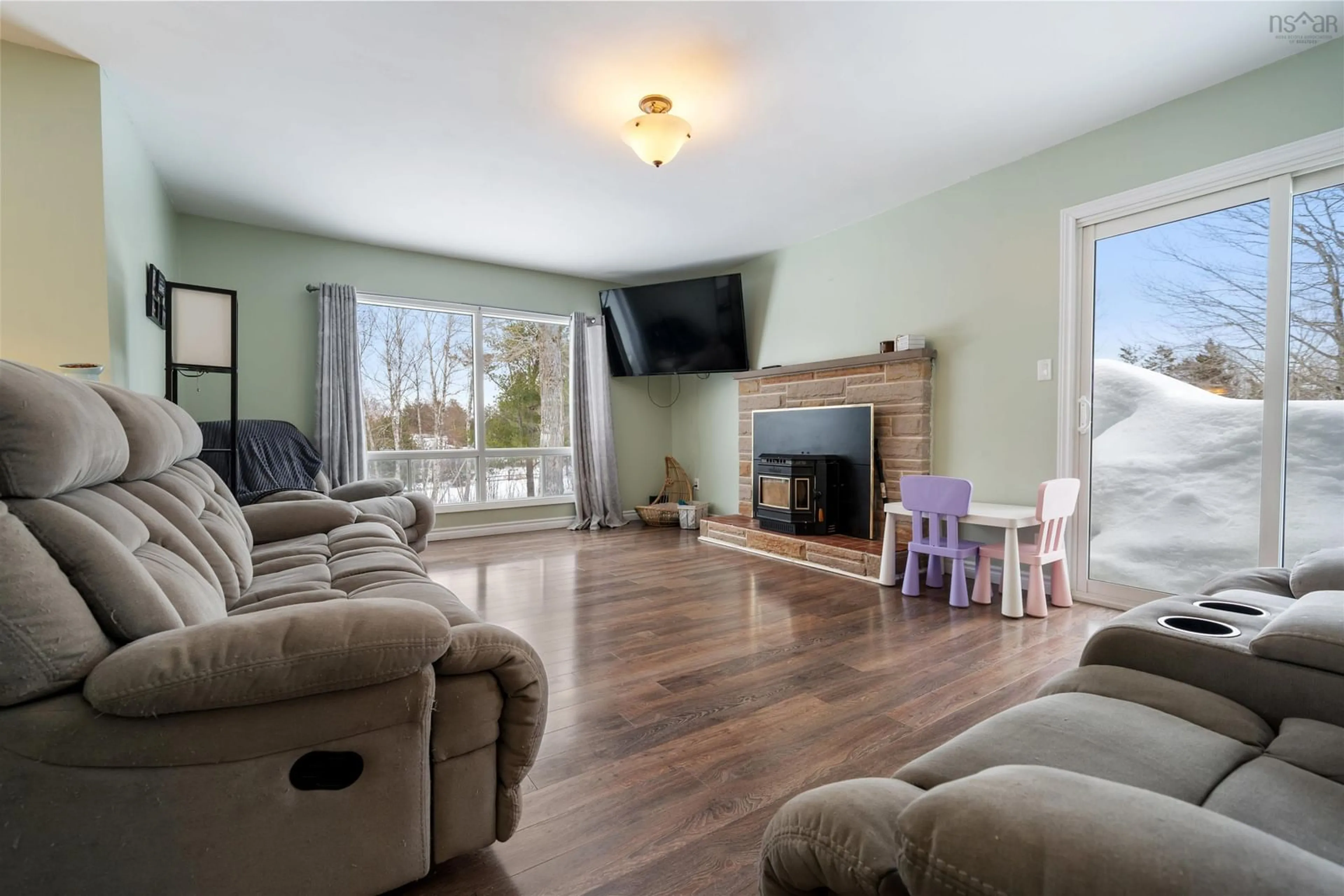 Living room with furniture, wood/laminate floor for 6540 Highway 4, Linacy Nova Scotia B2H 5C4