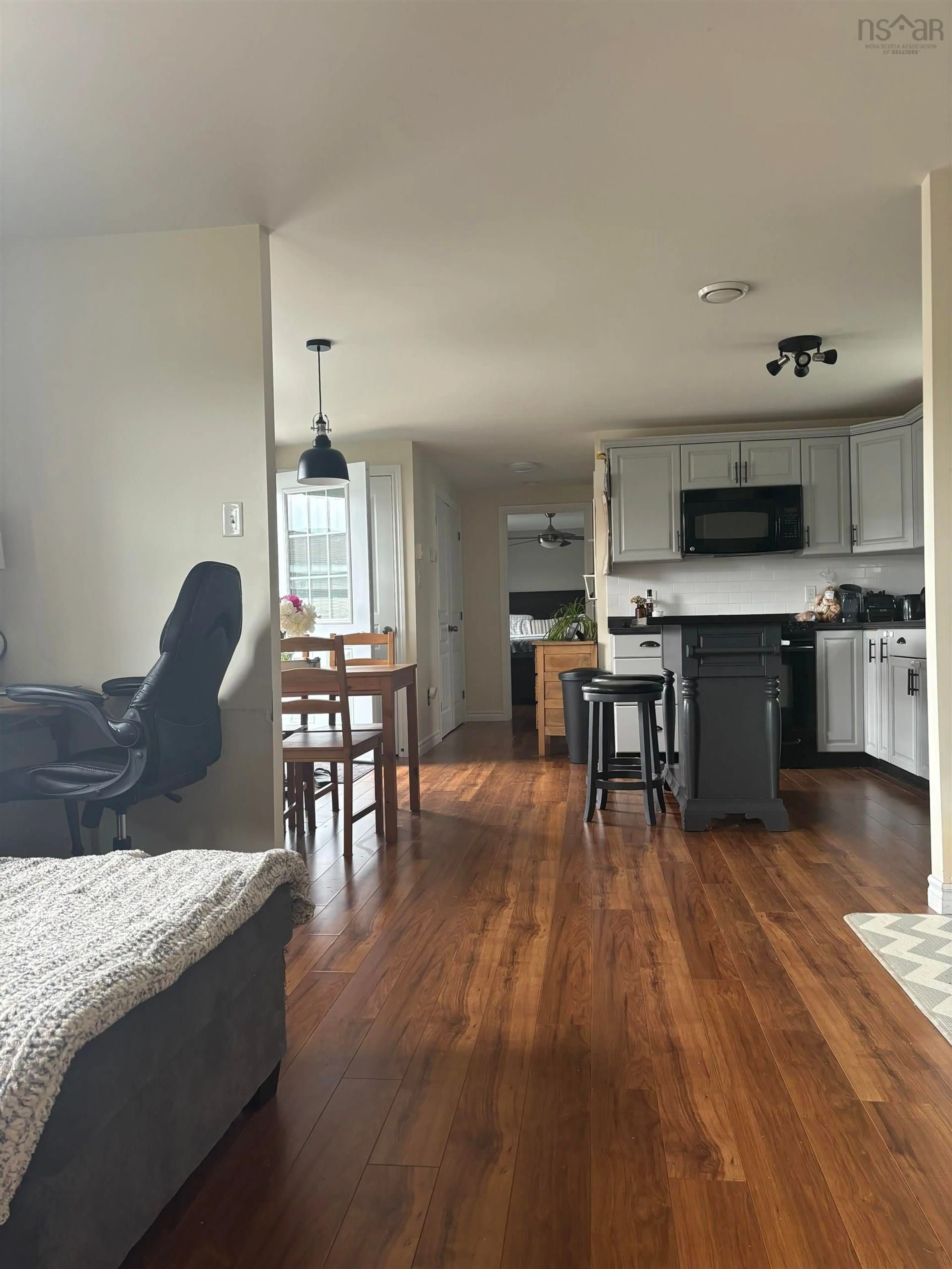 Open concept kitchen, wood/laminate floor for 10 South Hill Dr, Antigonish Nova Scotia B2G 2V9
