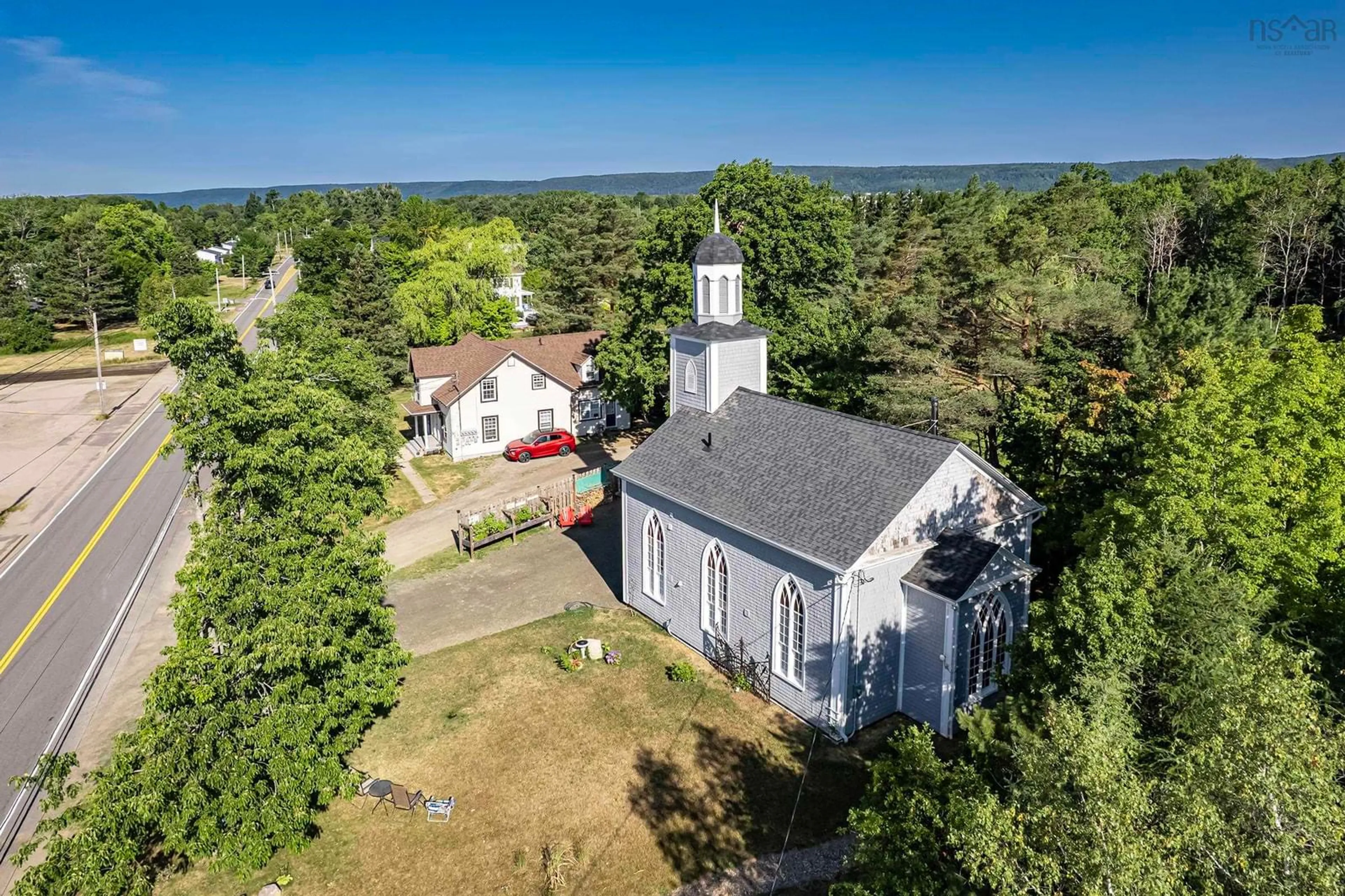 A pic from outside/outdoor area/front of a property/back of a property/a pic from drone, building for 579 Main St, Lawrencetown Nova Scotia B0S 1M0