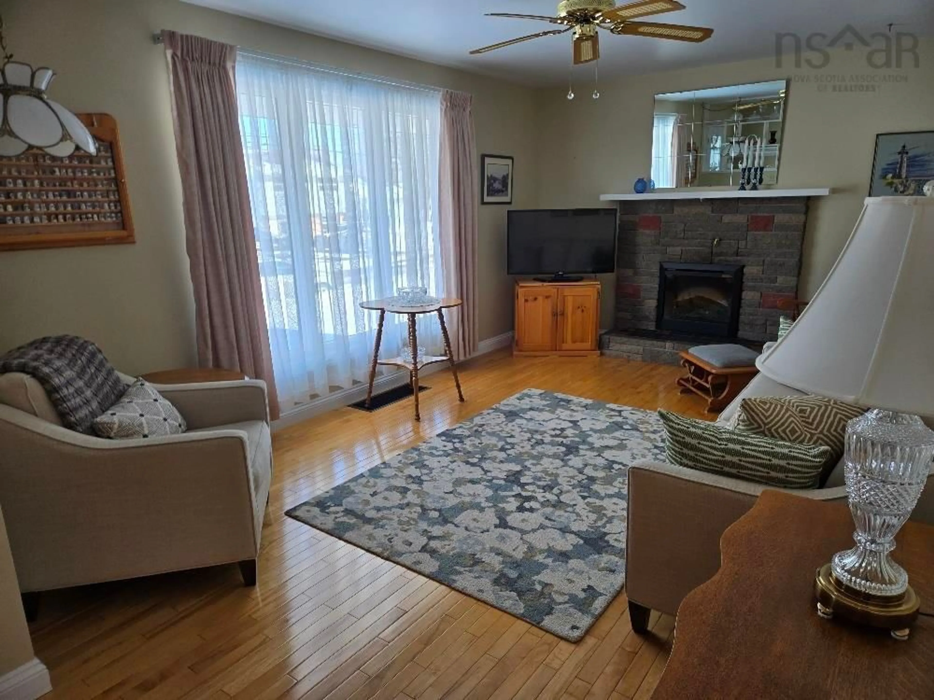 Living room with furniture, wood/laminate floor for 100 Higgins Street, Truro Nova Scotia B2N 2L7