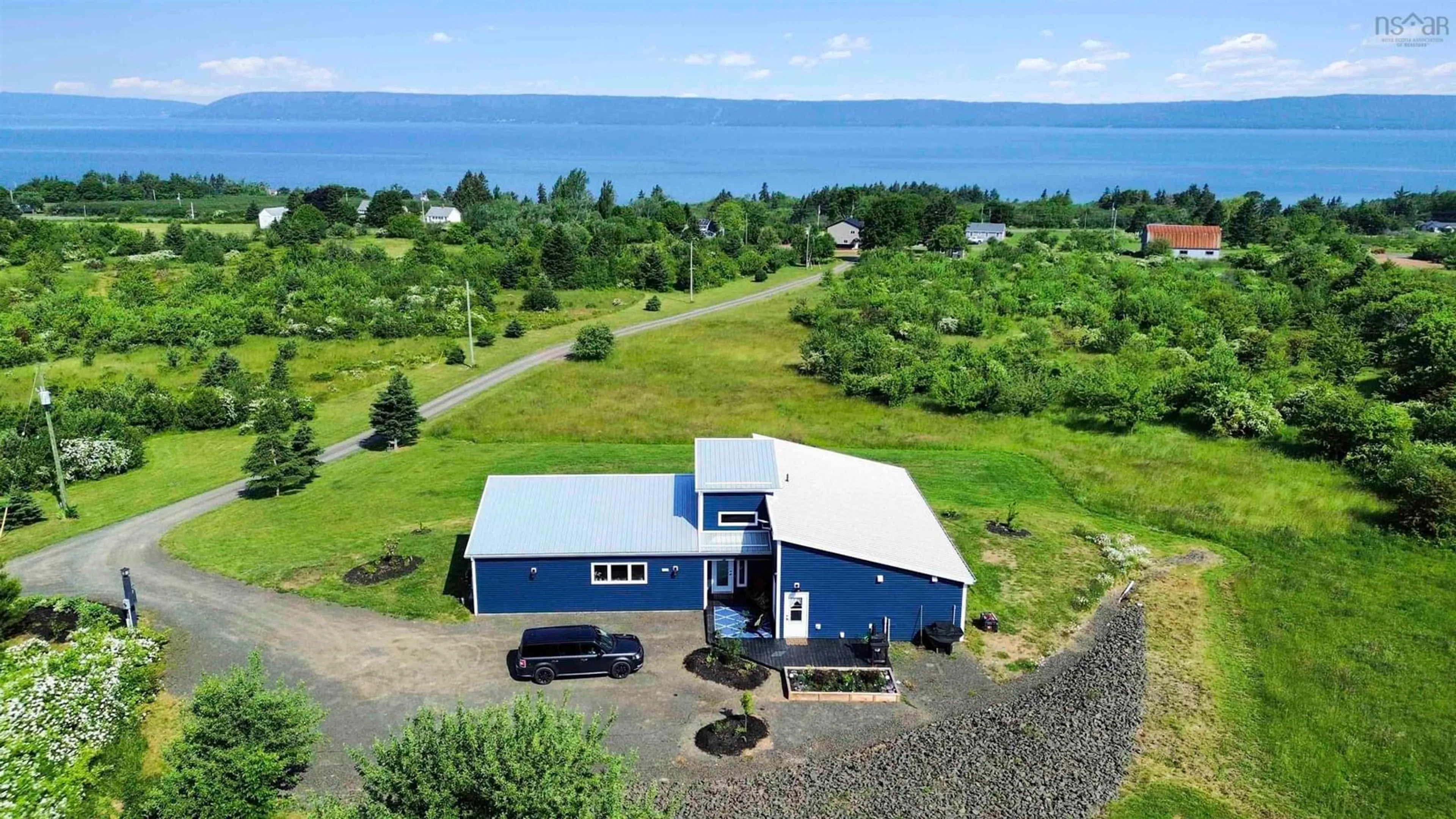A pic from outside/outdoor area/front of a property/back of a property/a pic from drone, water/lake/river/ocean view for 59 Deep Brook Lane, Deep Brook Nova Scotia B0S 1J0