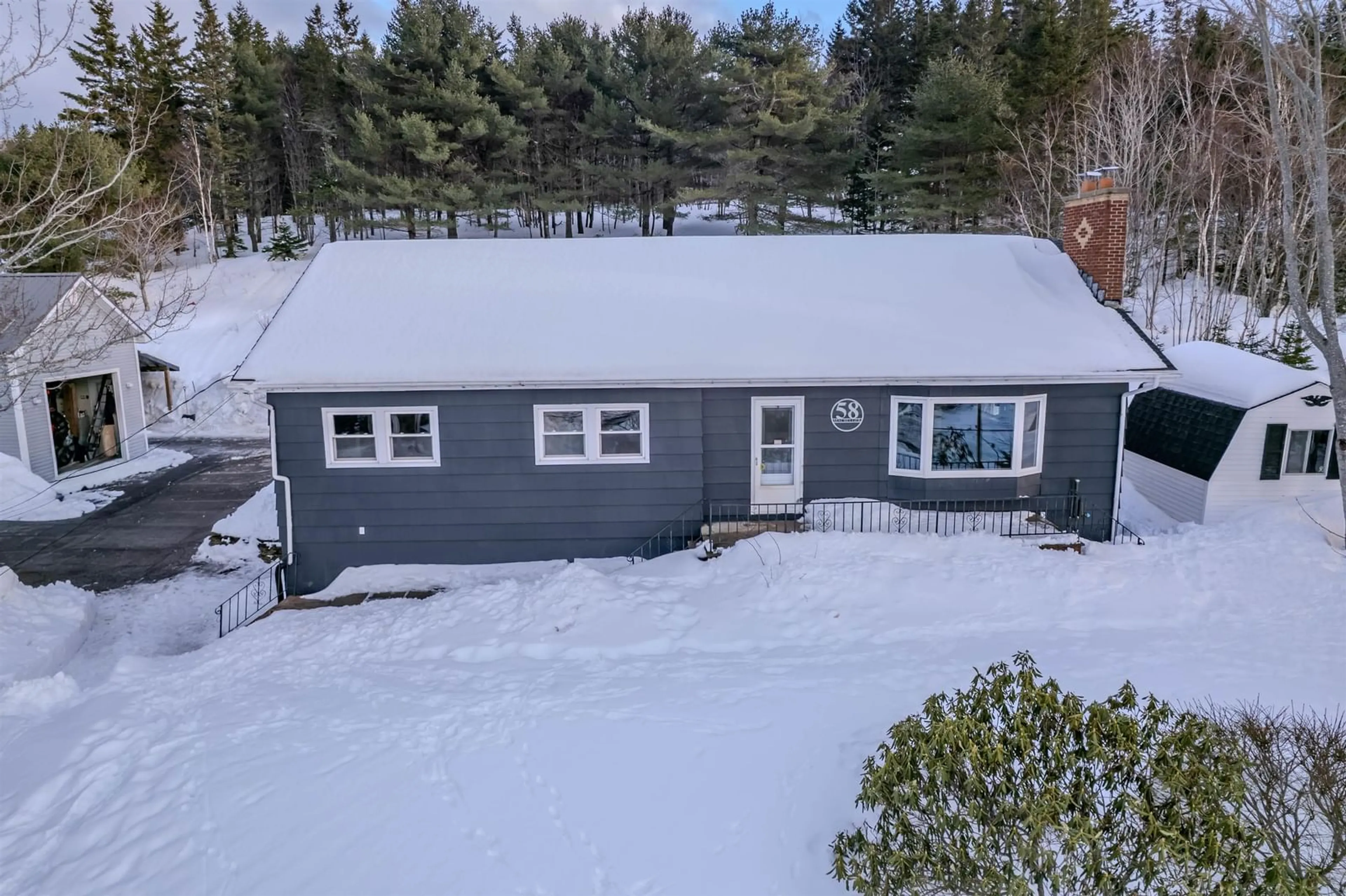 A pic from outside/outdoor area/front of a property/back of a property/a pic from drone, street for 58 Macbelger Cres, Boularderie East Nova Scotia B1X 1J3