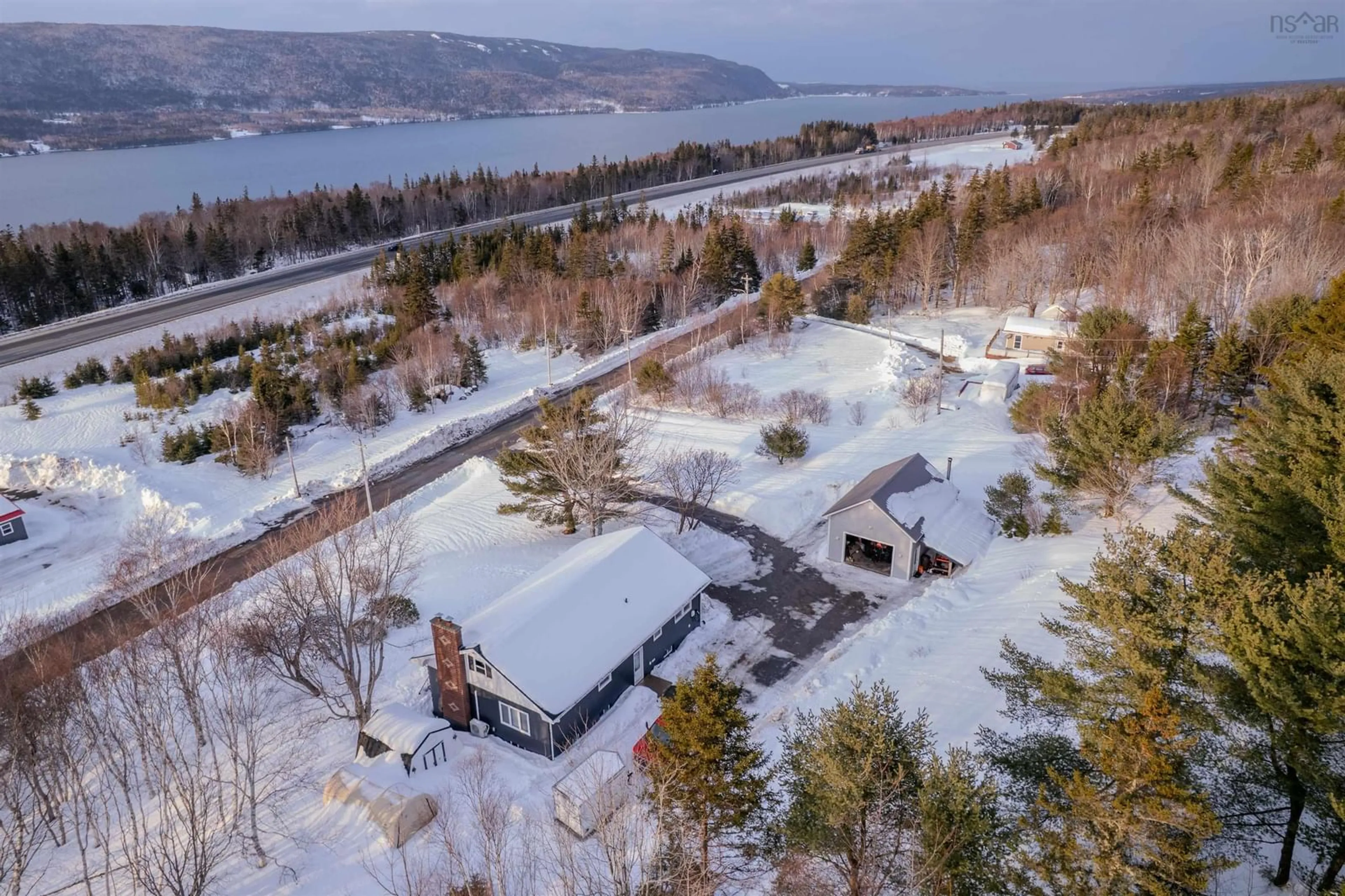 A pic from outside/outdoor area/front of a property/back of a property/a pic from drone, water/lake/river/ocean view for 58 Macbelger Cres, Boularderie East Nova Scotia B1X 1J3
