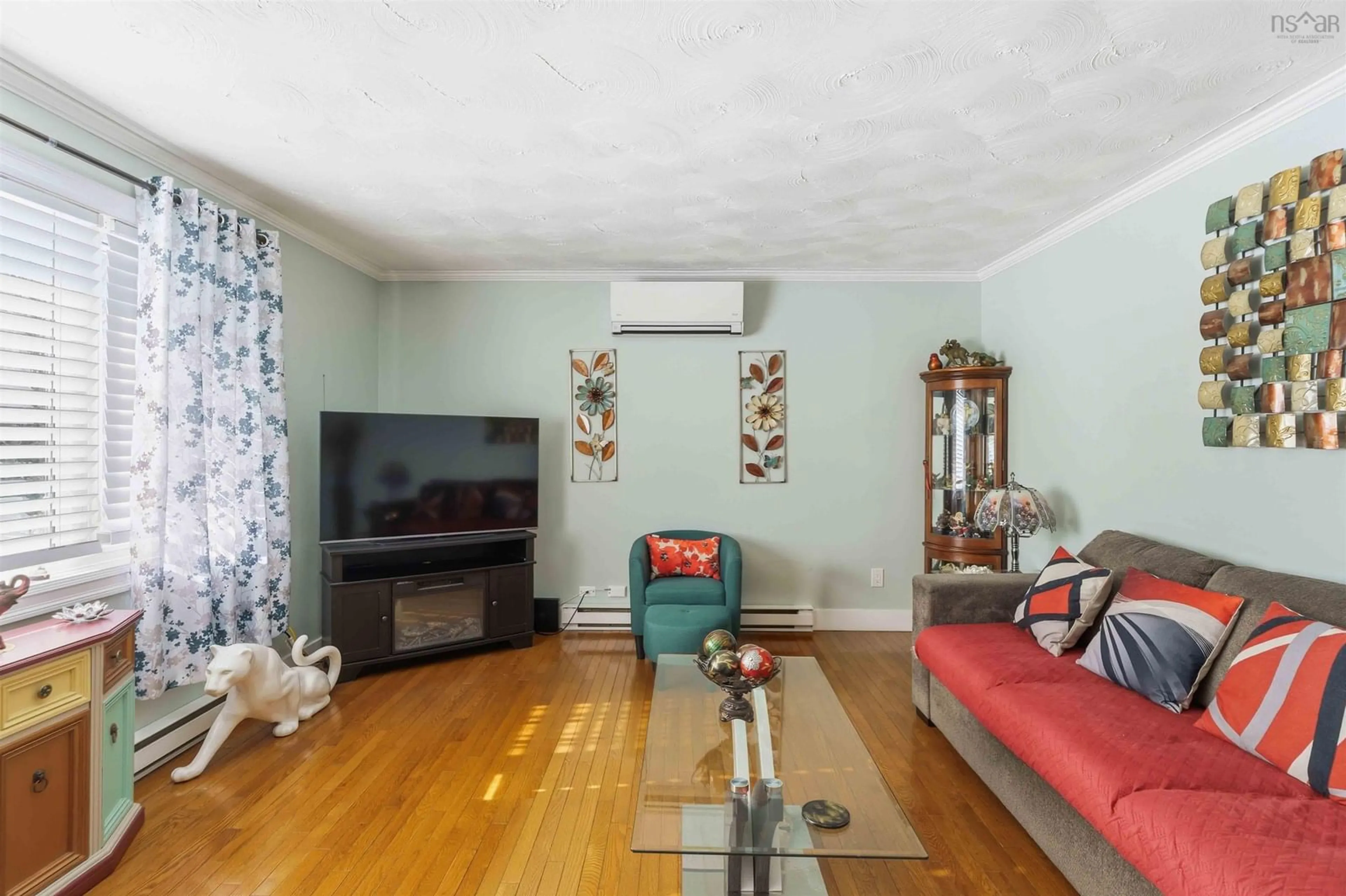 Living room with furniture, wood/laminate floor for 893 Main St, Kingston Nova Scotia B0P 1R0