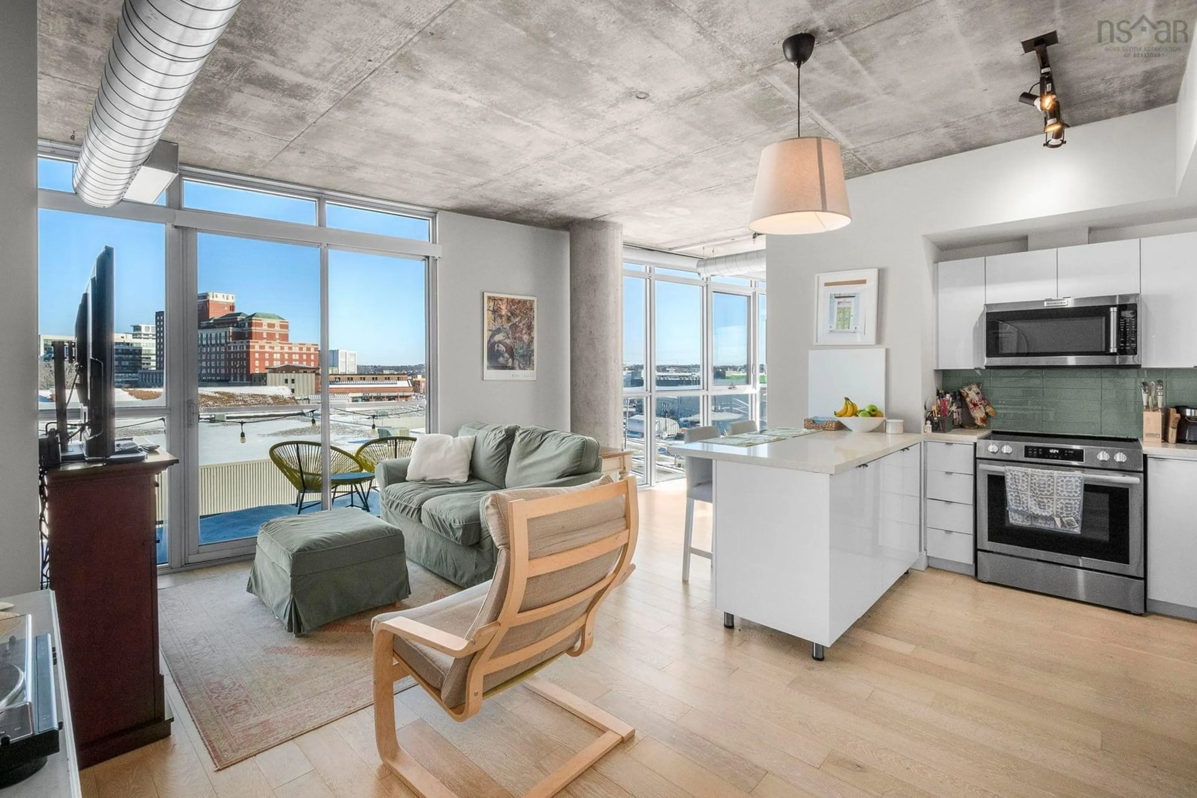 Open concept kitchen, cement floor for 1065 Barrington St #508, Halifax Nova Scotia B3H 0B7