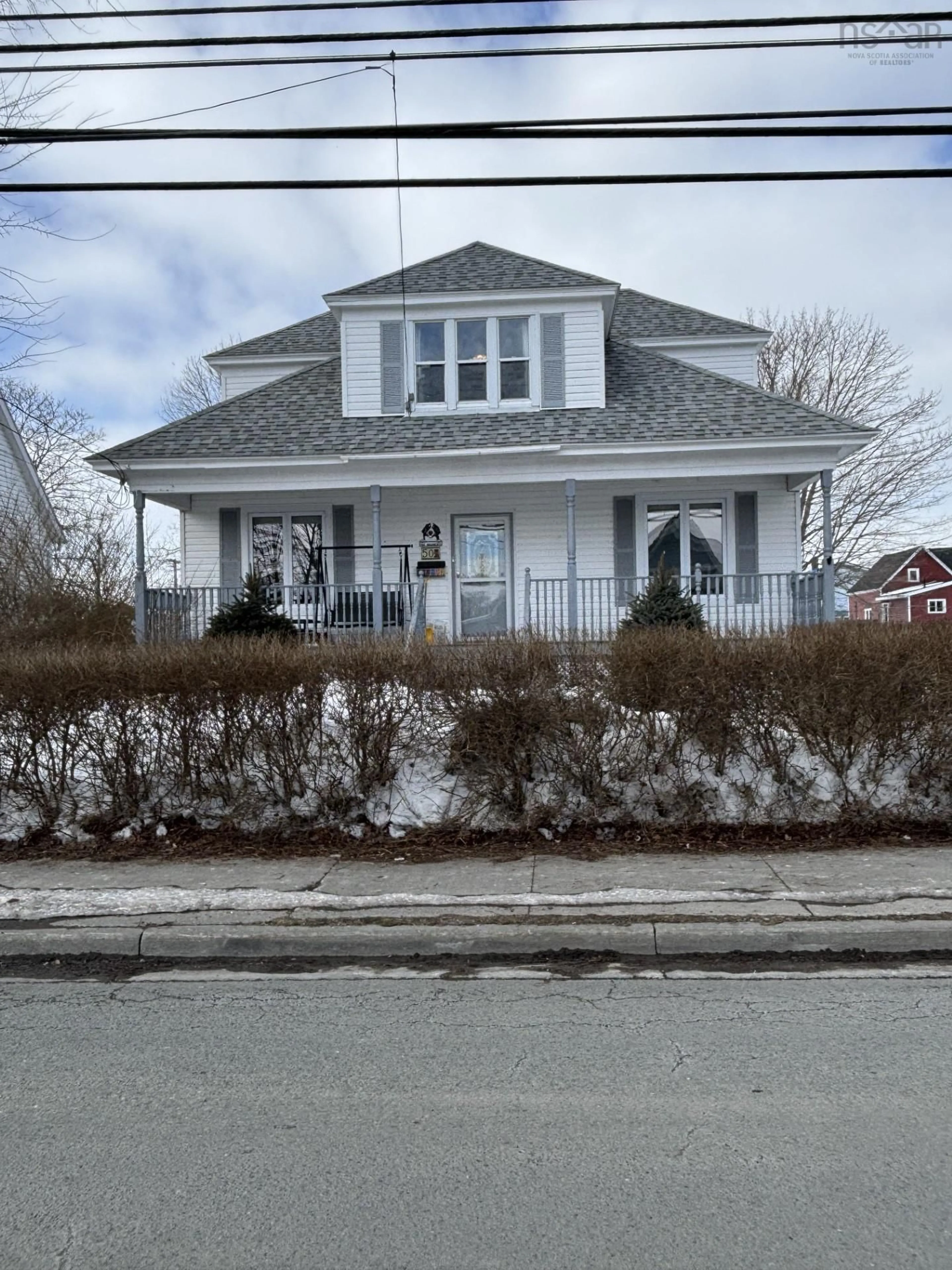 Home with vinyl exterior material, street for 50 Pierce St, North Sydney Nova Scotia B2A 1M9