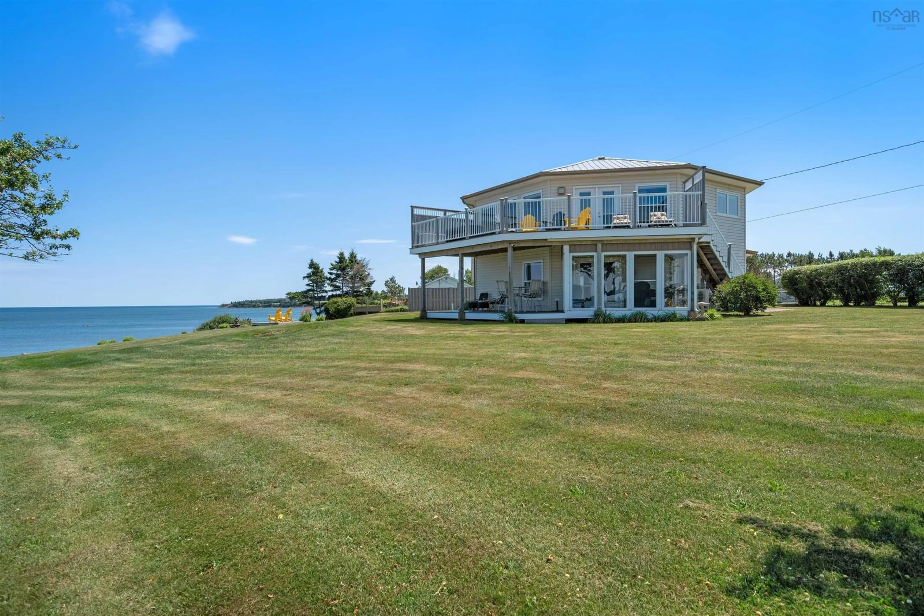 A pic from outside/outdoor area/front of a property/back of a property/a pic from drone, water/lake/river/ocean view for 51 Chapman Lane, Lorneville Nova Scotia B4H 3X9