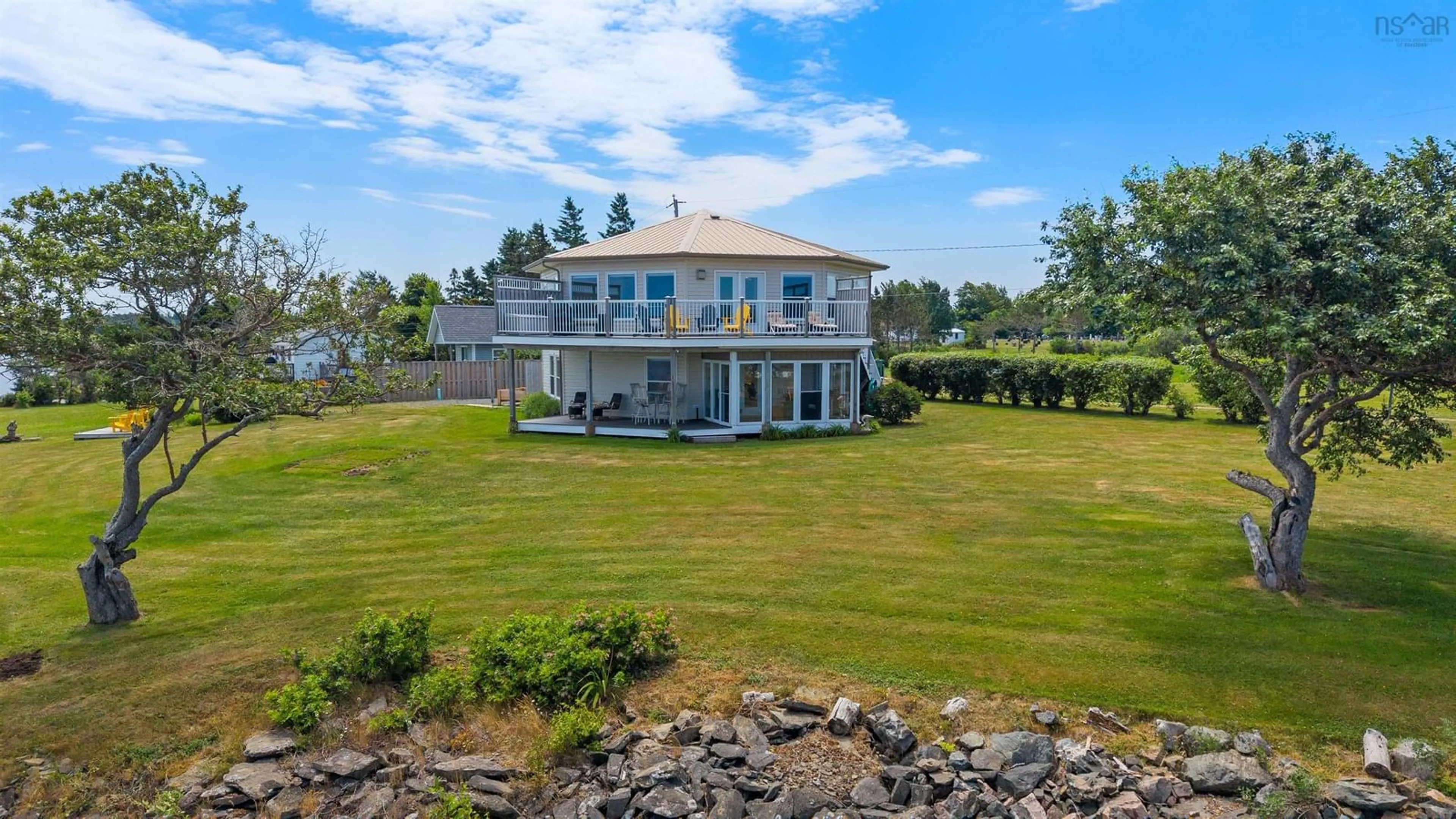 A pic from outside/outdoor area/front of a property/back of a property/a pic from drone, water/lake/river/ocean view for 51 Chapman Lane, Lorneville Nova Scotia B4H 3X9