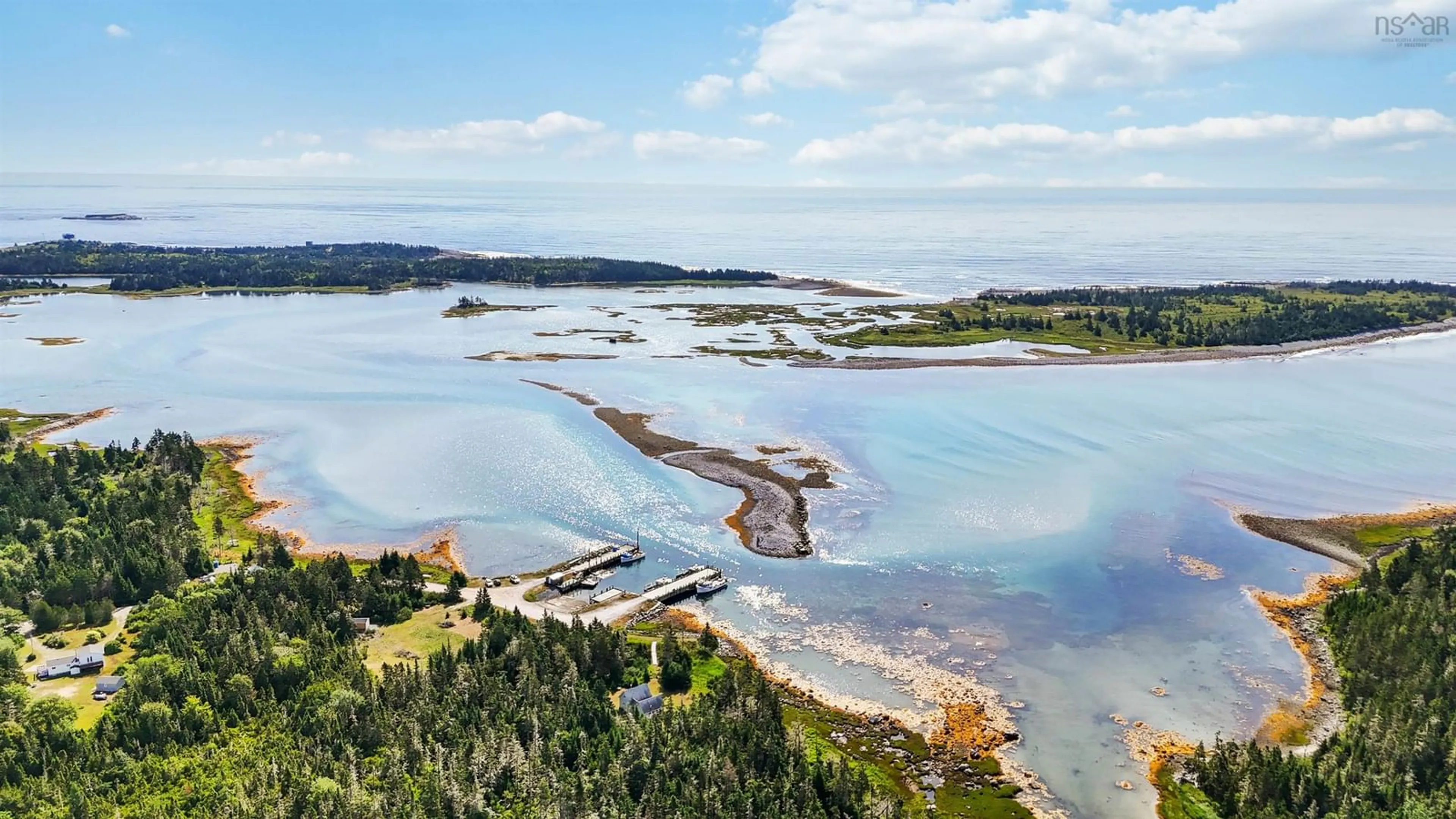 A pic from outside/outdoor area/front of a property/back of a property/a pic from drone, water/lake/river/ocean view for 238 Jones Harbour Rd, East Sable River Nova Scotia B0T 1V0