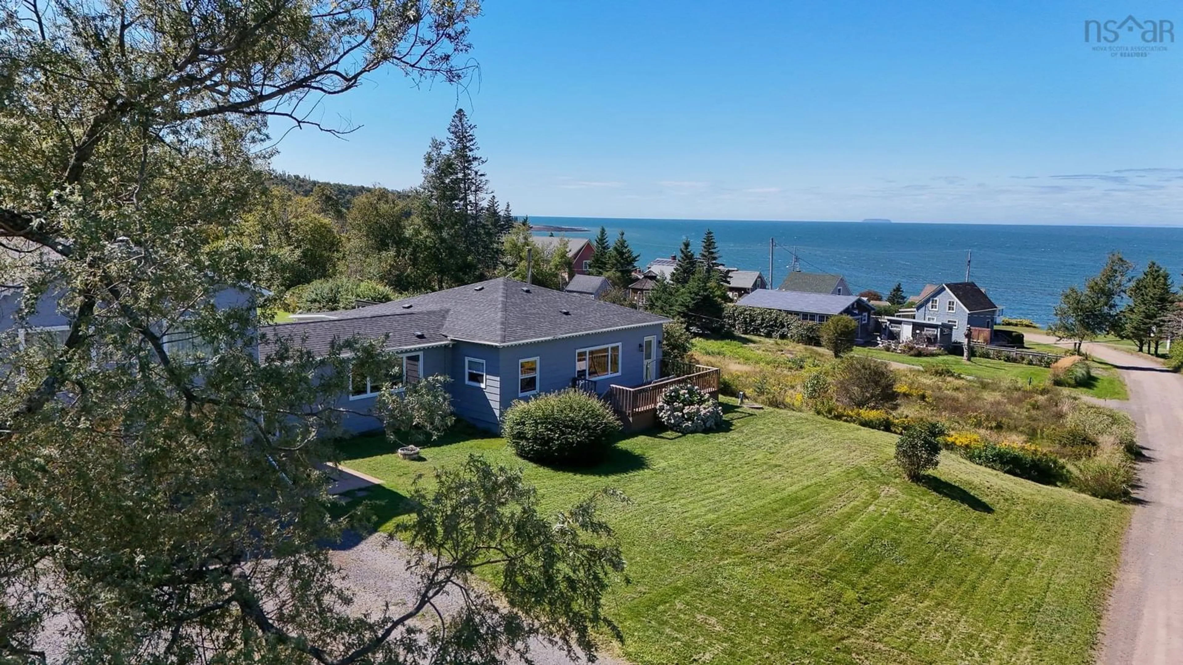 A pic from outside/outdoor area/front of a property/back of a property/a pic from drone, water/lake/river/ocean view for 60 Cove Rd, Halls Harbour Nova Scotia B0P 1J0
