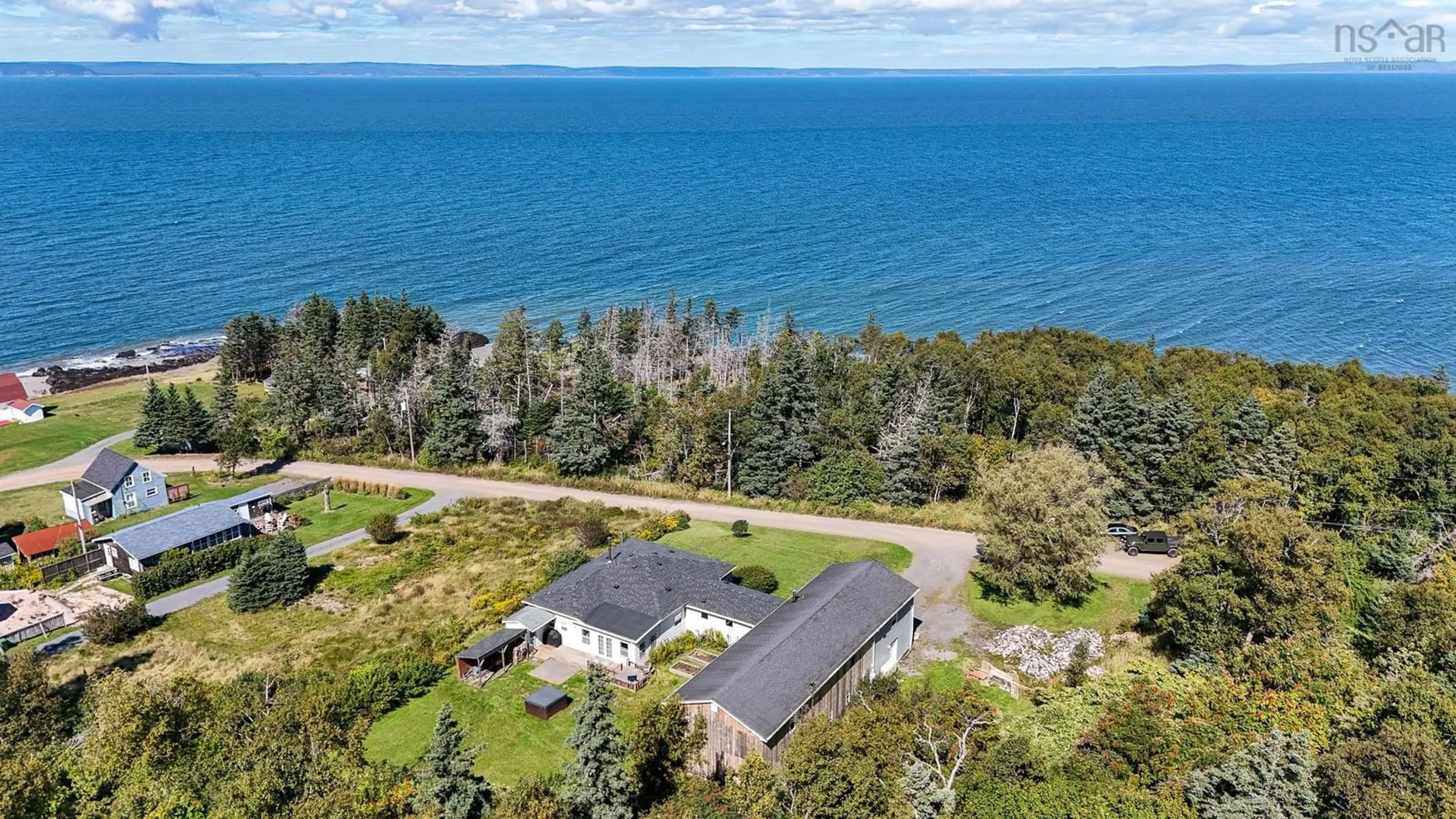 A pic from outside/outdoor area/front of a property/back of a property/a pic from drone, water/lake/river/ocean view for 60 Cove Rd, Halls Harbour Nova Scotia B0P 1J0