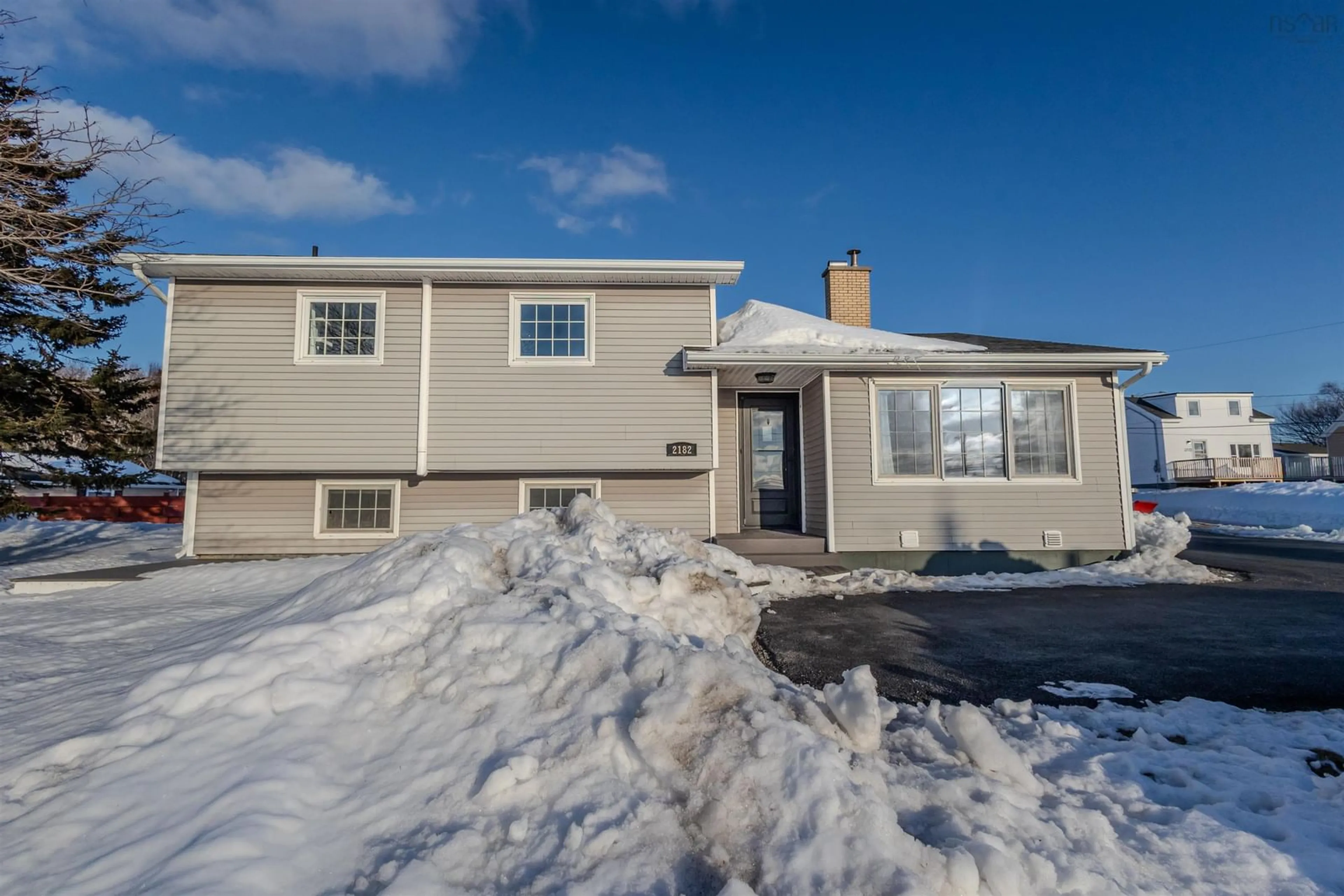 Home with vinyl exterior material, street for 2182 New Waterford Hwy, South Bar Nova Scotia B1N 3H7