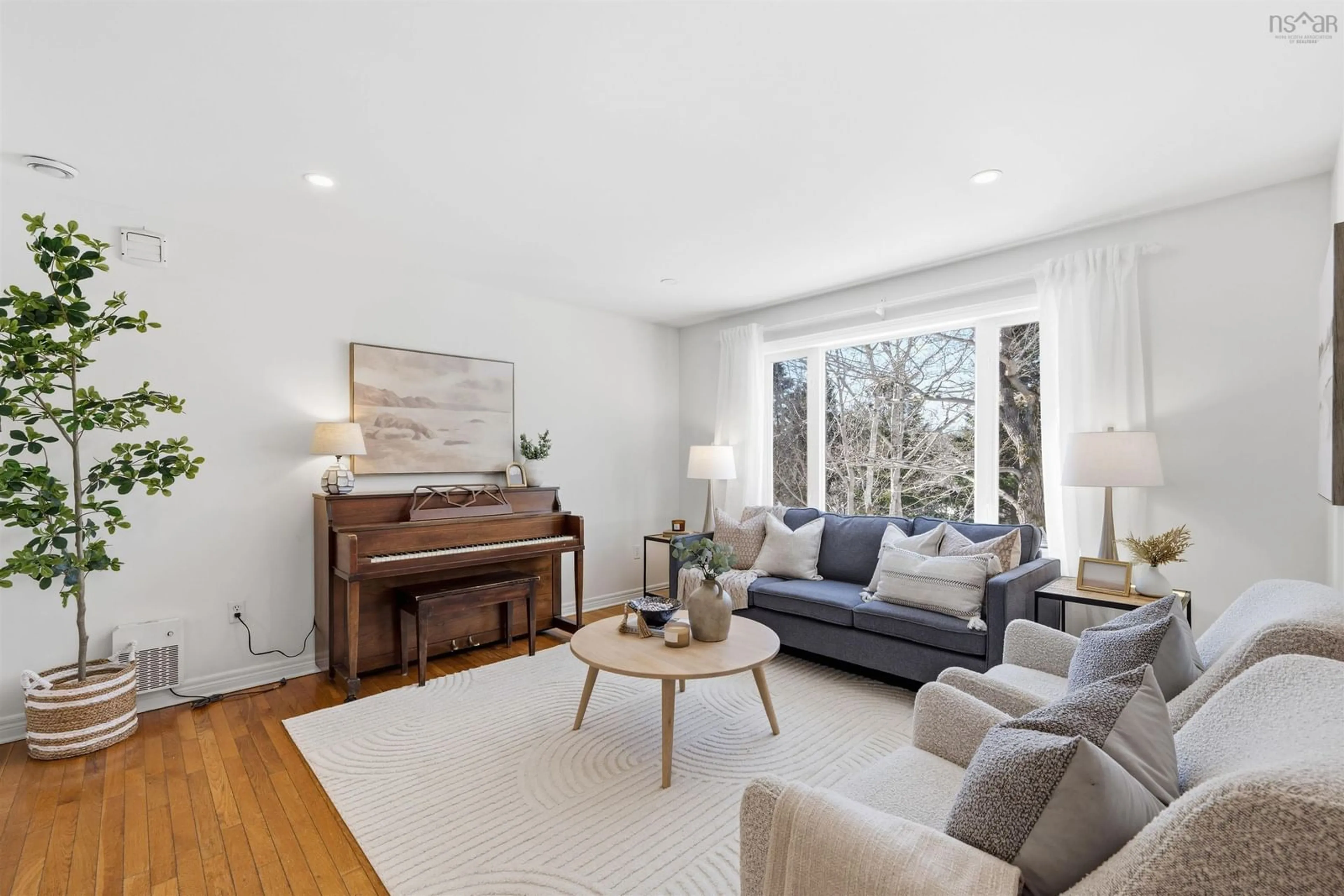 Living room with furniture, wood/laminate floor for 19 Kilbride Dr, Stillwater Lake Nova Scotia B3Z 1P4