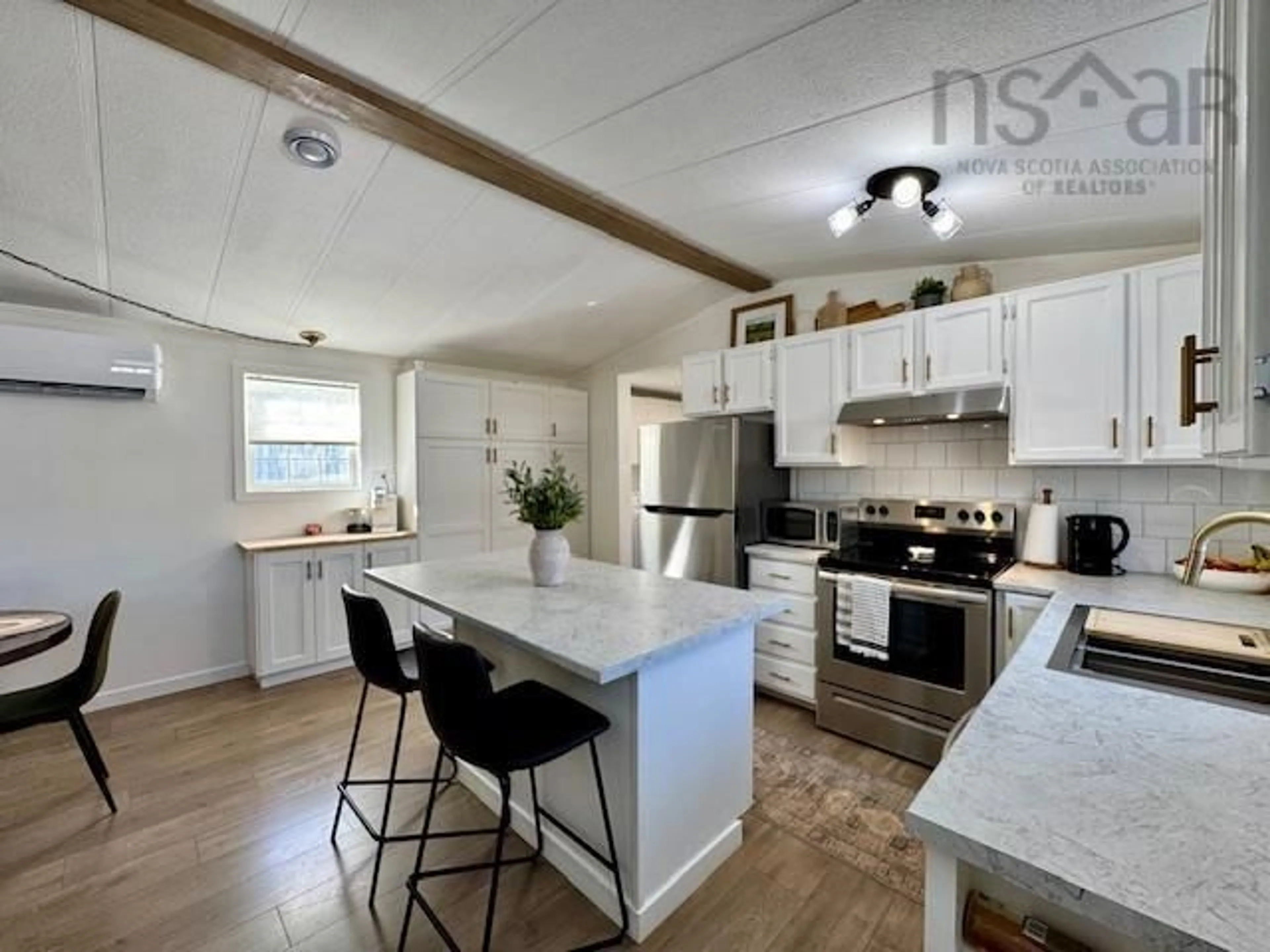 Open concept kitchen, wood/laminate floor for 5 Hazel St, Middle Sackville Nova Scotia B4E 1E5