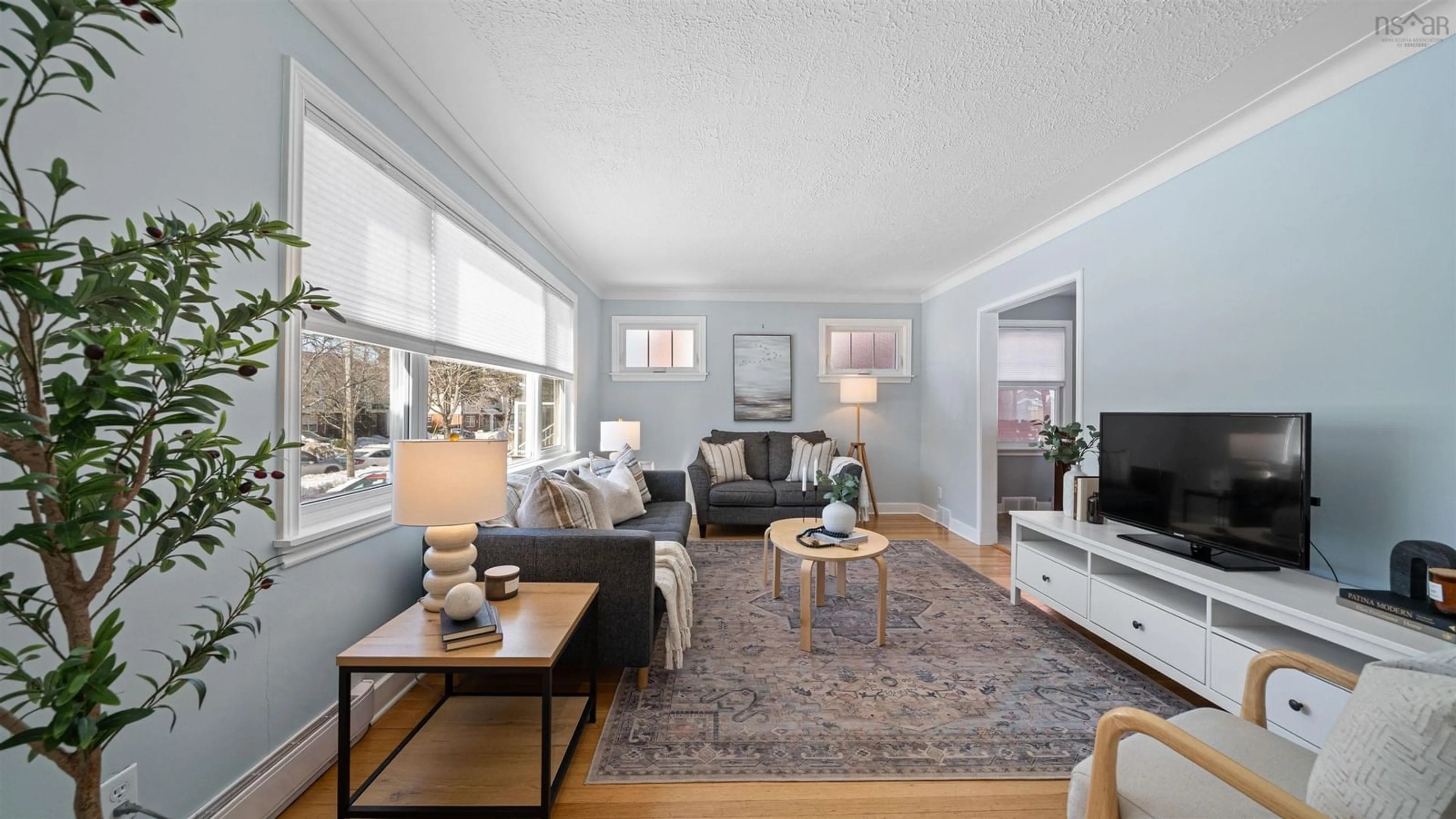 Living room with furniture, wood/laminate floor for 3815 Memorial Dr, Halifax Nova Scotia B3K 5A4