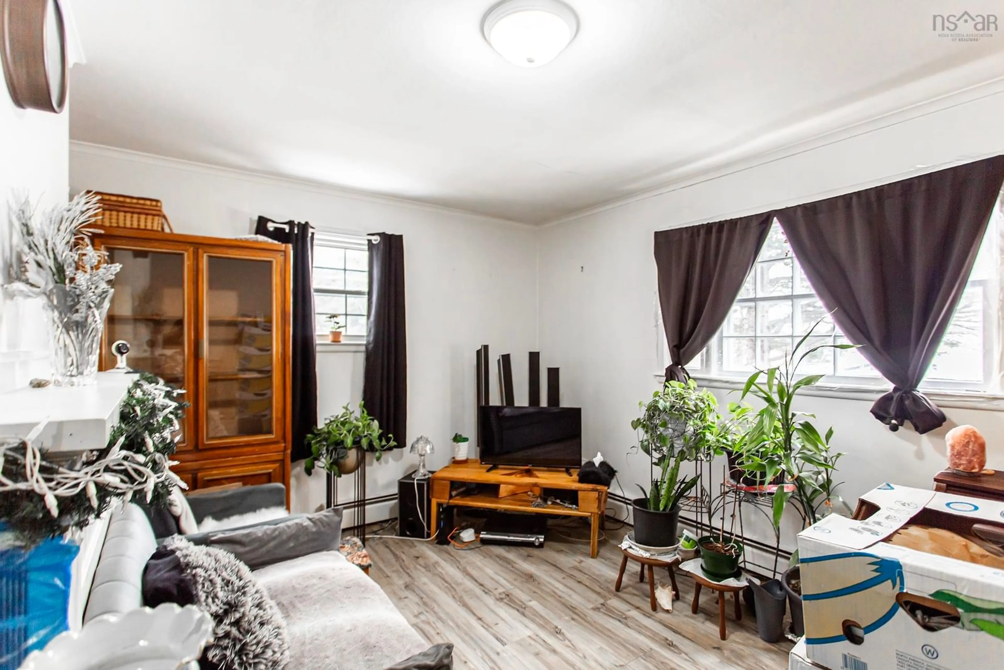 Living room with furniture, wood/laminate floor for 499 Main St, Middleton Nova Scotia B0S 1P0