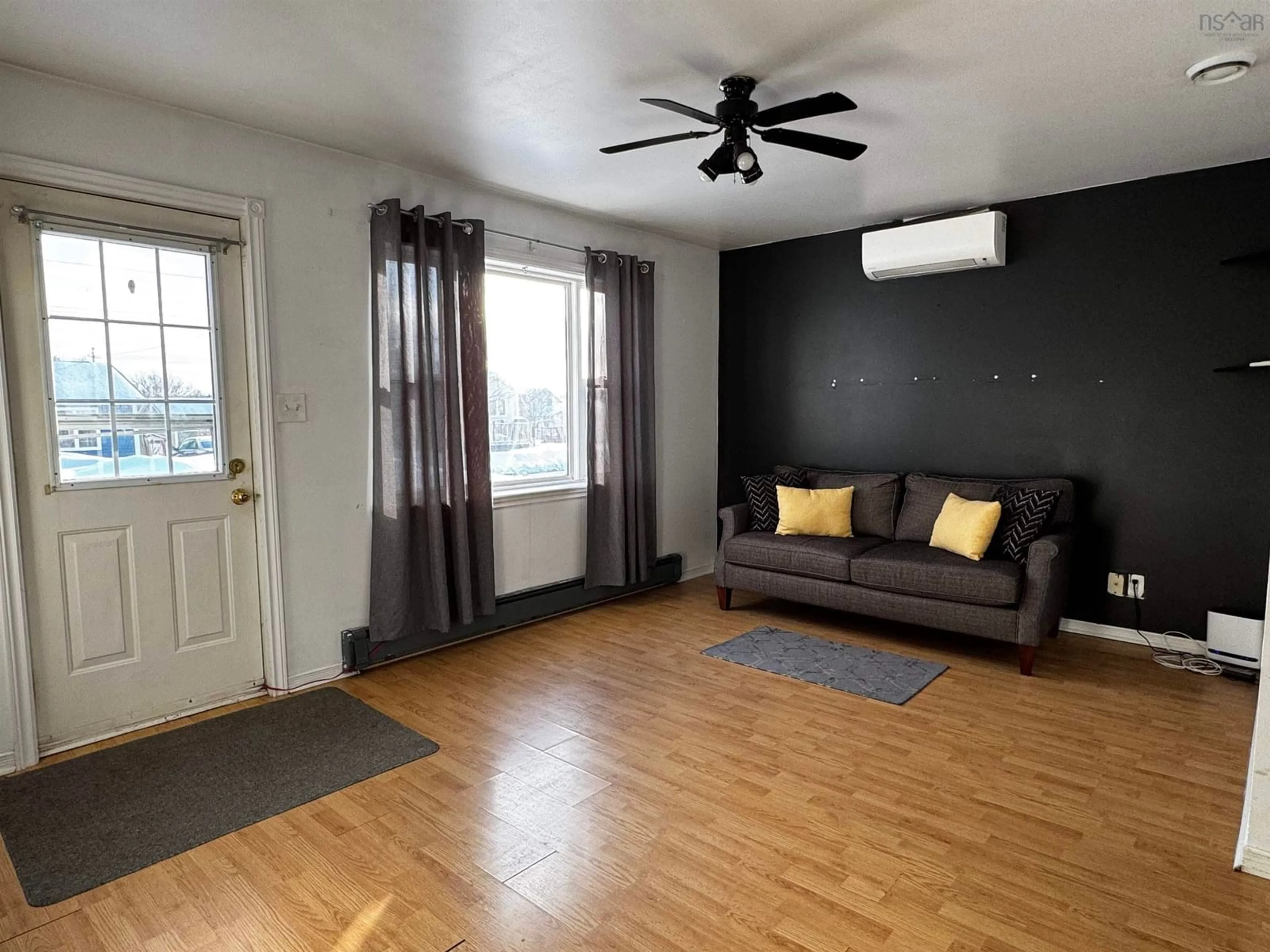 Living room with furniture, wood/laminate floor for 186 Tennyson St, Glace Bay Nova Scotia B1A 5M3