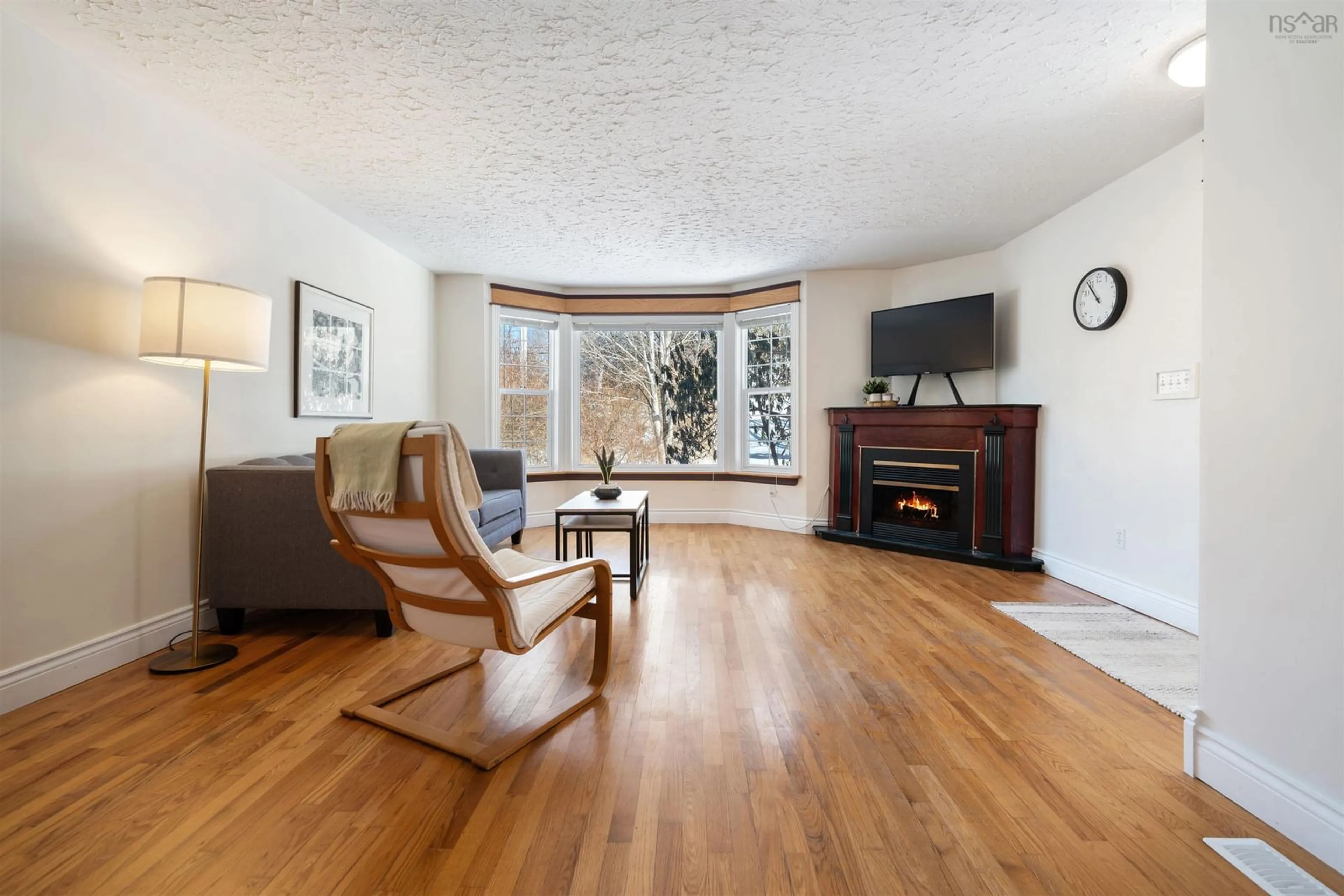 Living room with furniture, wood/laminate floor for 1054 Montague Rd, Montague Gold Mines Nova Scotia B2R 1T8