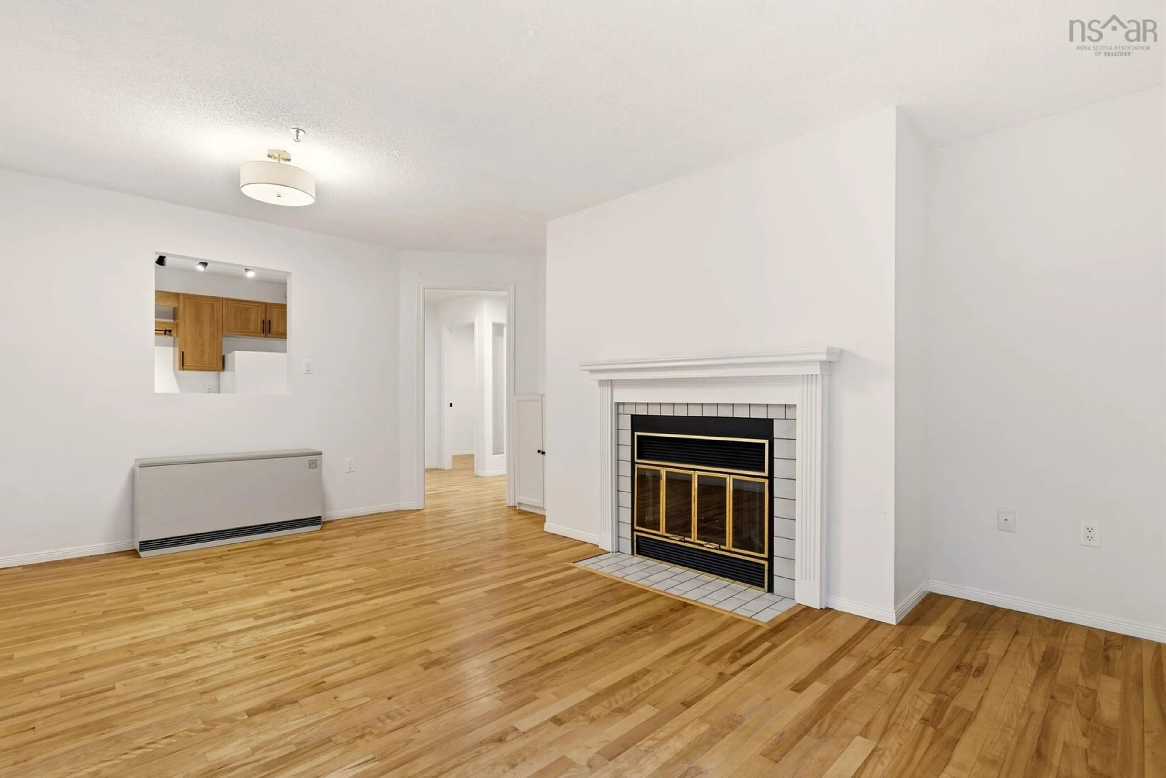 Living room with furniture, wood/laminate floor for 3600 John Parr Dr #304, Halifax Nova Scotia B3K 5V3