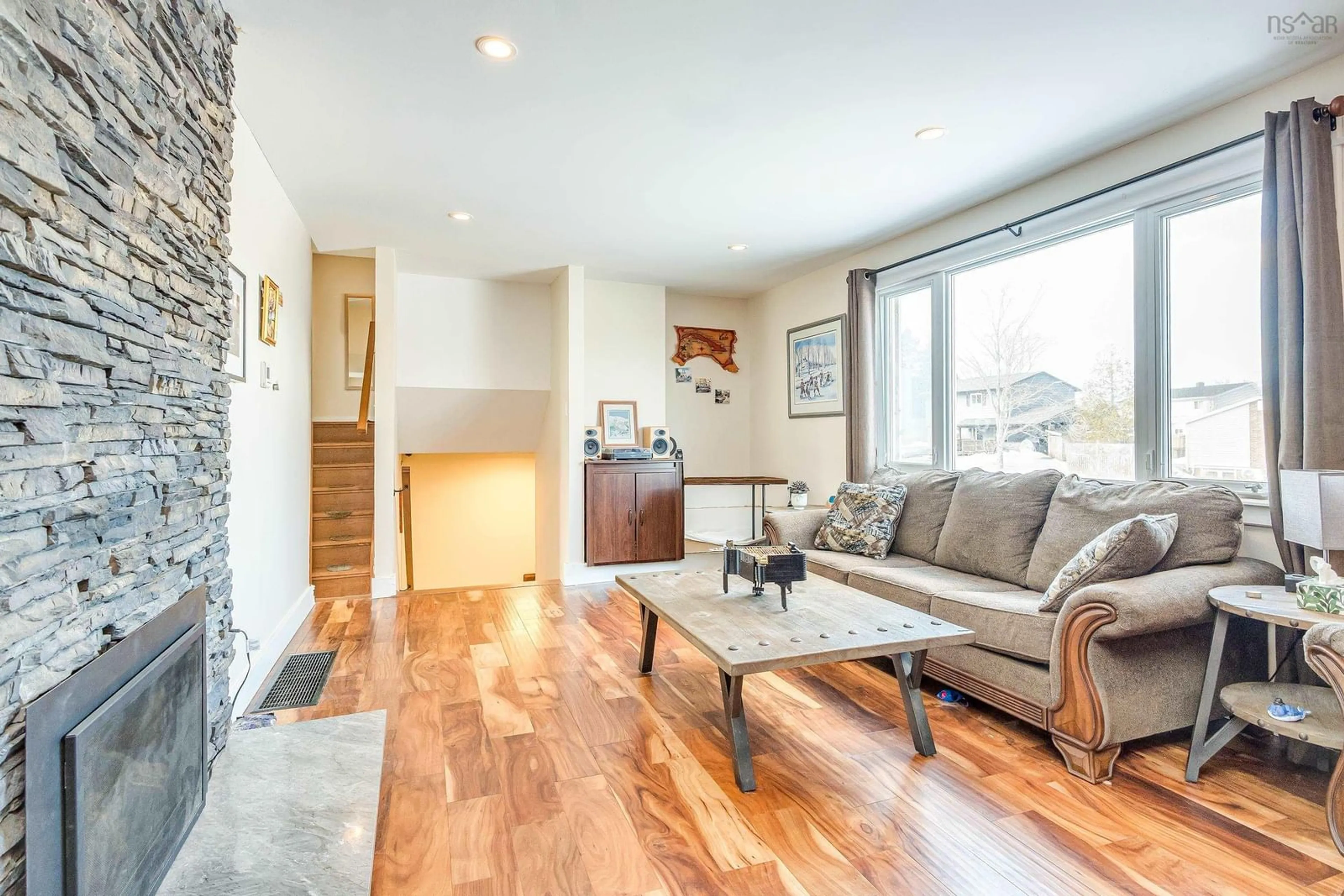 Living room with furniture, wood/laminate floor for 207 Colby Dr, Dartmouth Nova Scotia B2V 1K2