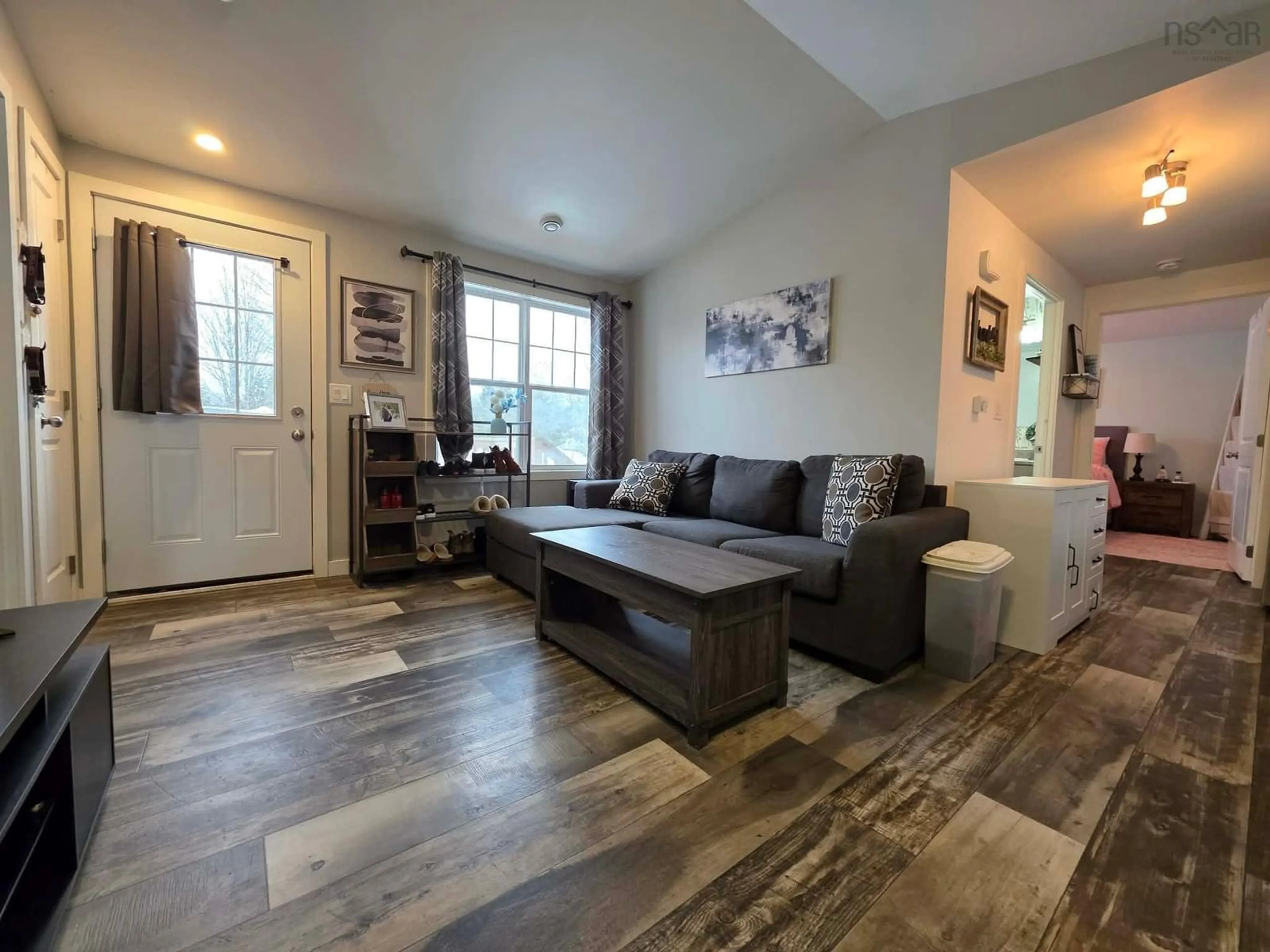 Living room with furniture, wood/laminate floor for 148 Guest Dr, Bible Hill Nova Scotia B2N 6N9